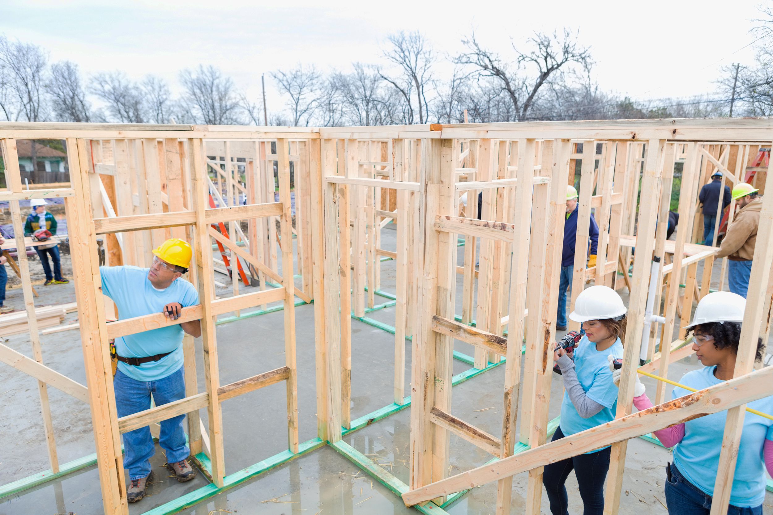 team of volunteers building charity home