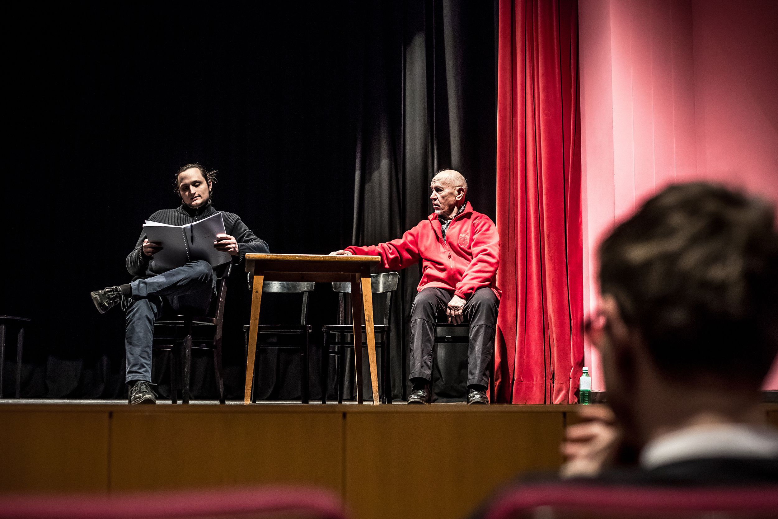 senior and middle-aged man on stage during an improv acting class