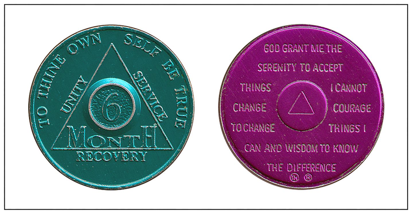 AA medal, given to those who have been sober a certain number of months, on the back stands the Serenity Prayer, purple medal is for 9 months sobriety.