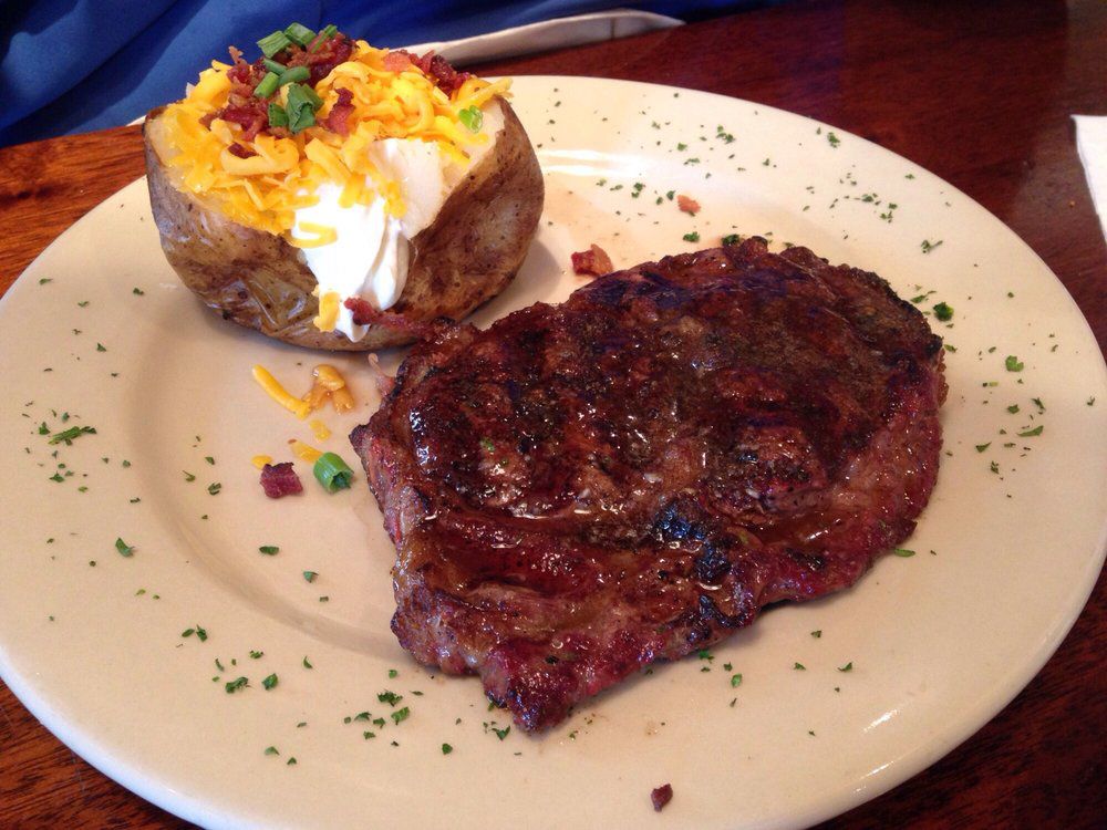 Franklin Chop House Steak and Potato Sprinkled with Parsley in Franklin, Tennessee