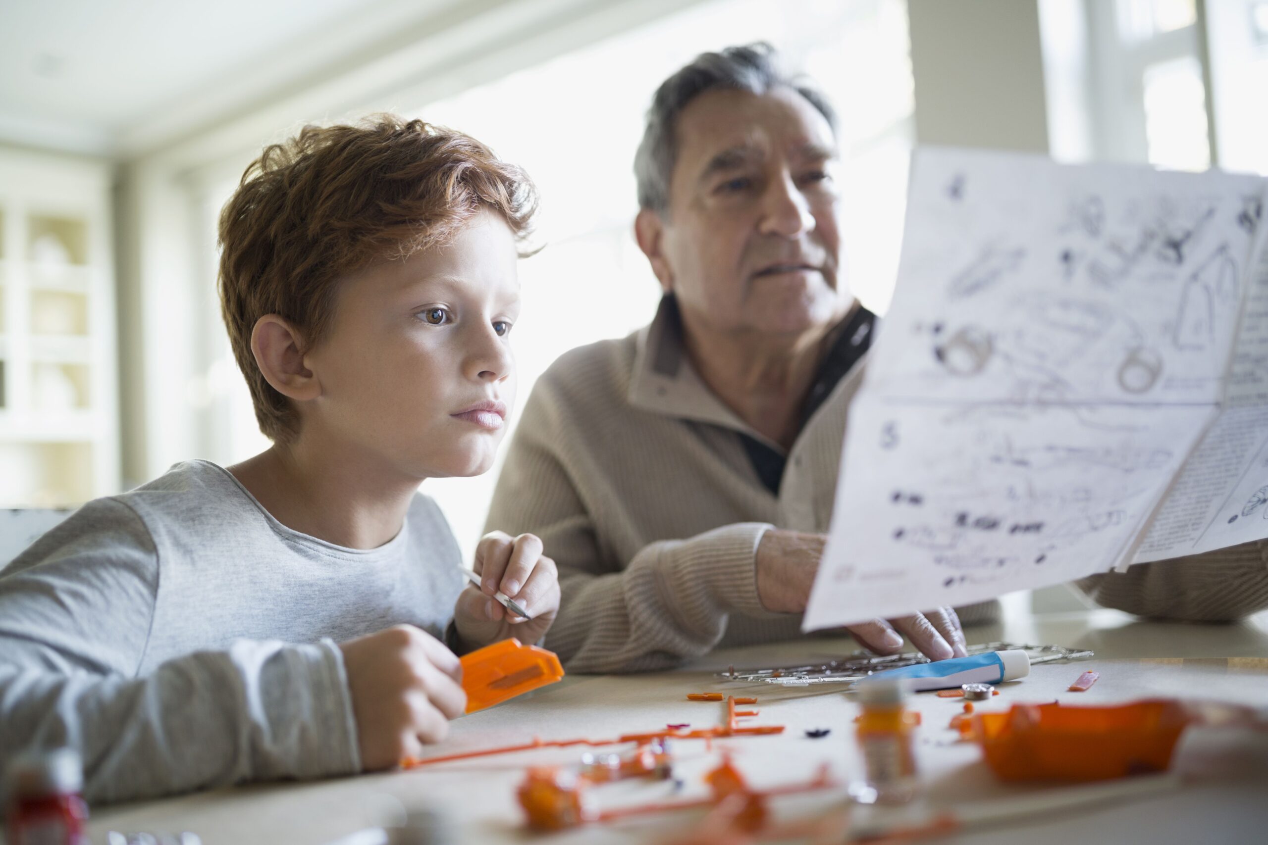 parent and child setting up toy
