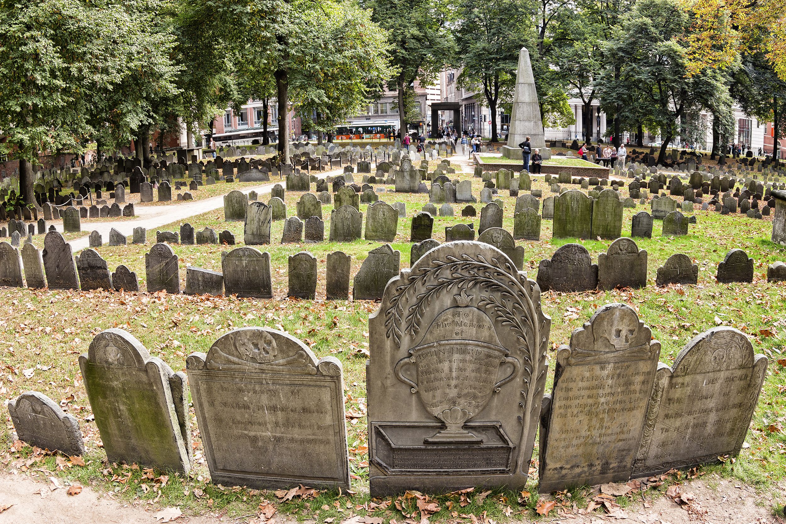 Granary Burying Ground, Boston, several rows of headstones with trees along the edges, the city street in the background