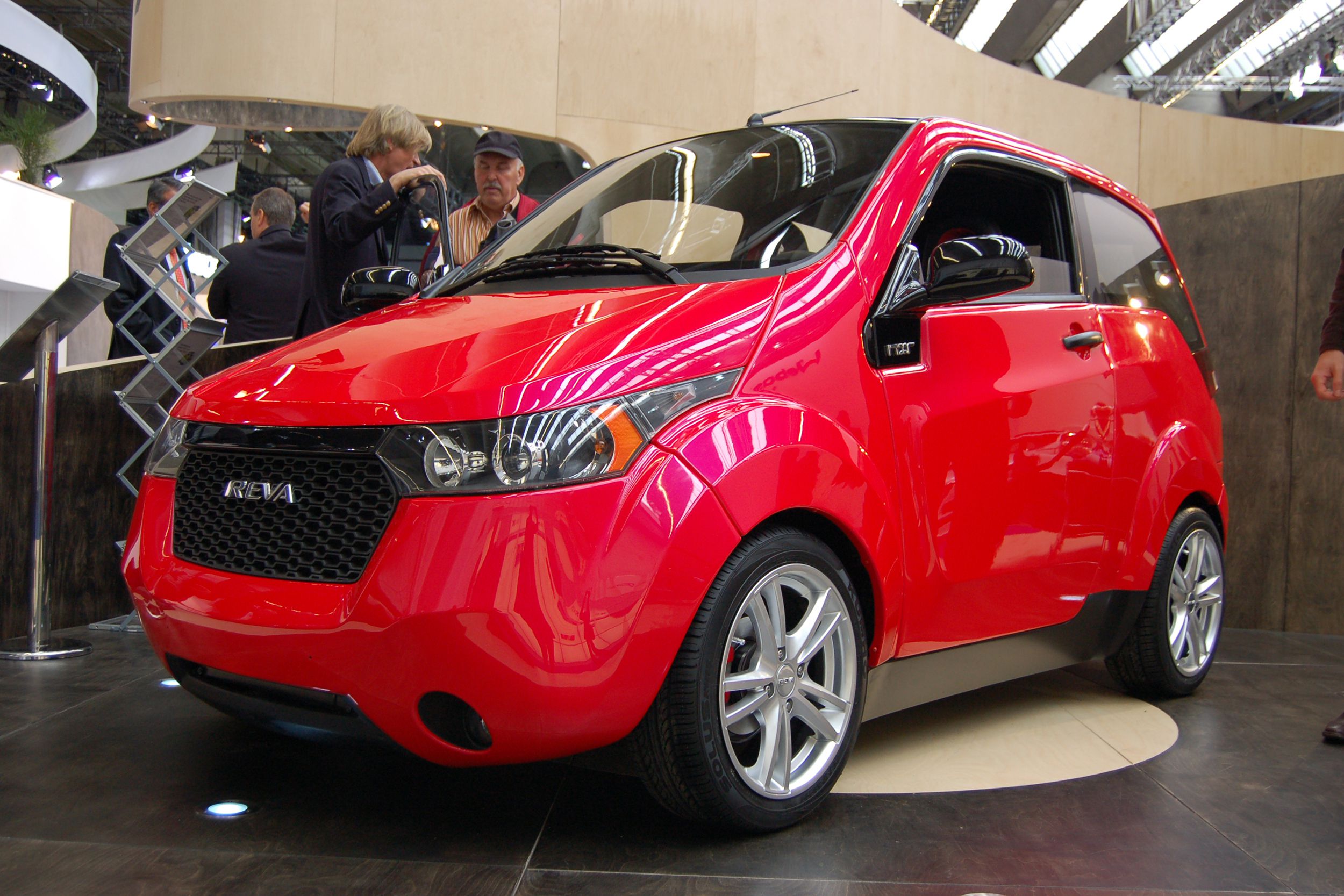 Red Mahindra e2o in a showroom