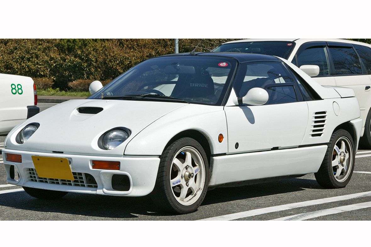 White Mazda Autozam AZ-1 in a sunny parking lot