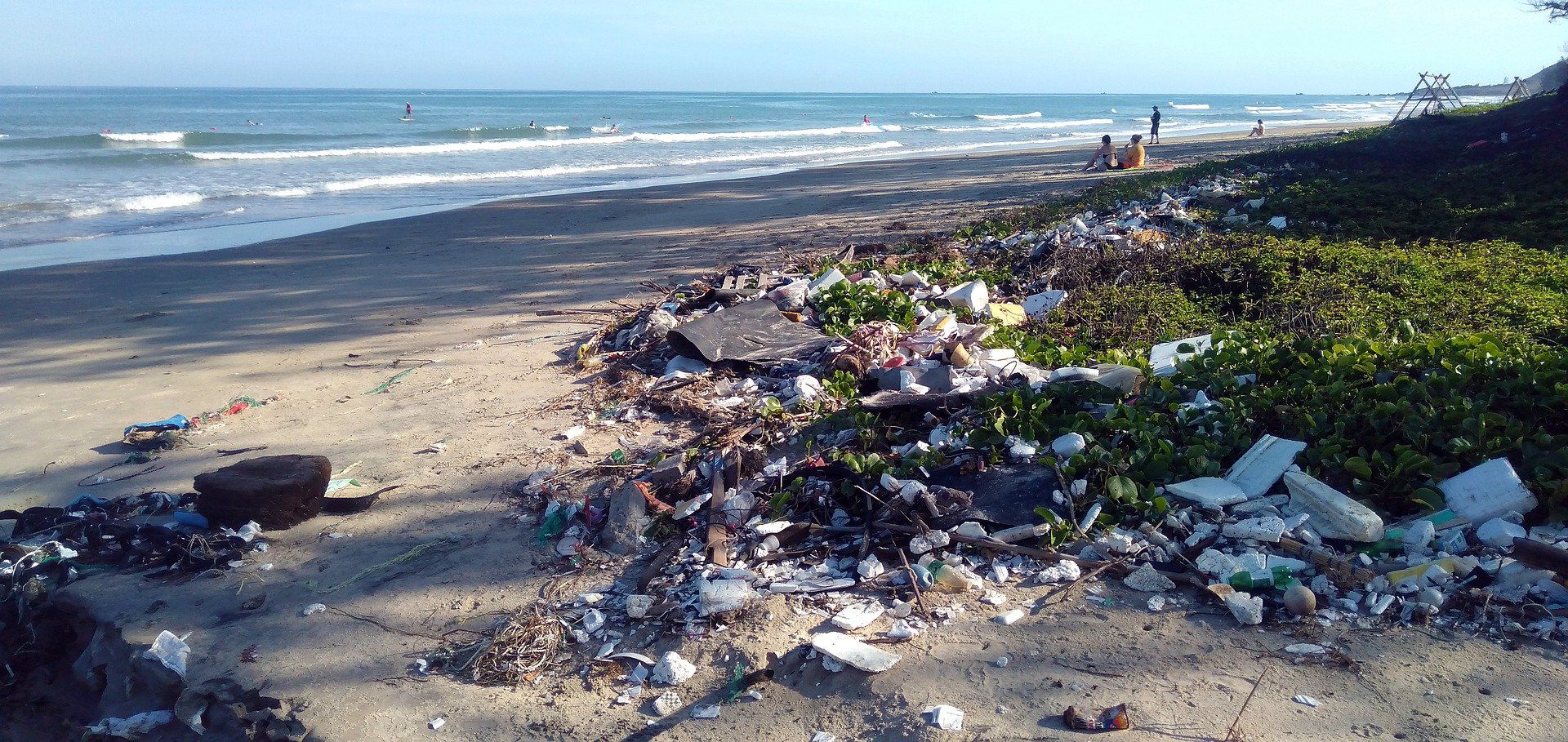 plastic and other garbage washed up on shore from the ocean