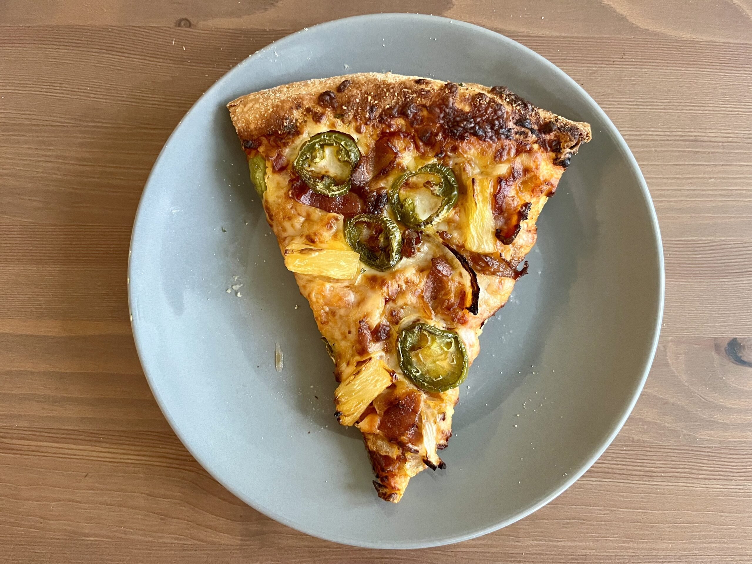 a slice of pizza reheated in the