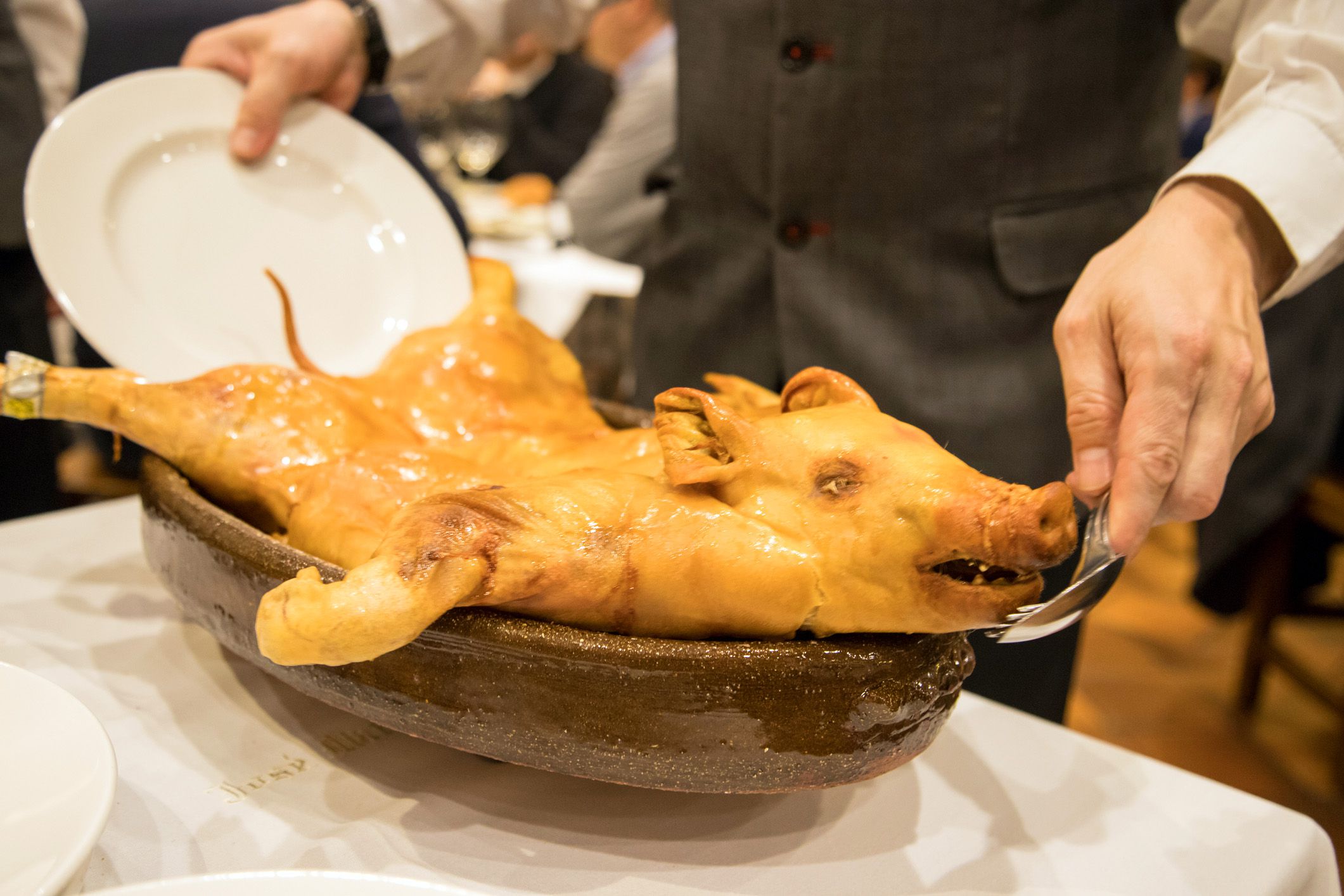 cochinillo from Segovia about to be cut into servings