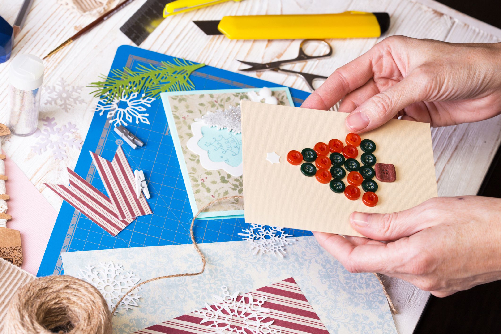 hands holding holiday cards