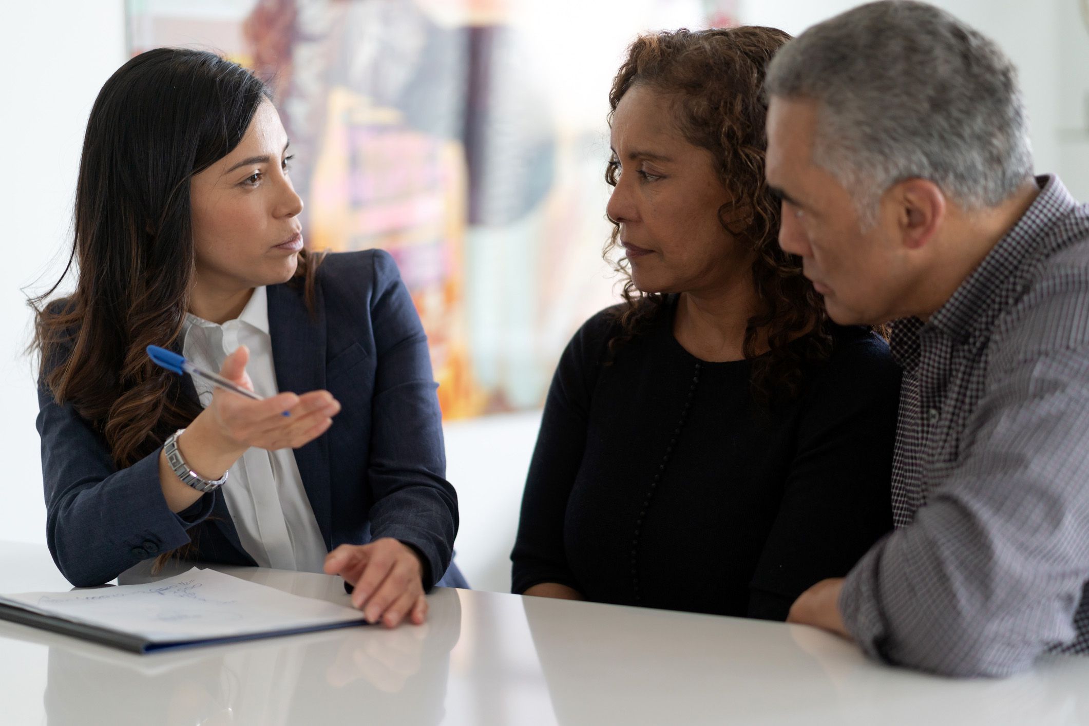 mature couple speaking to accountant