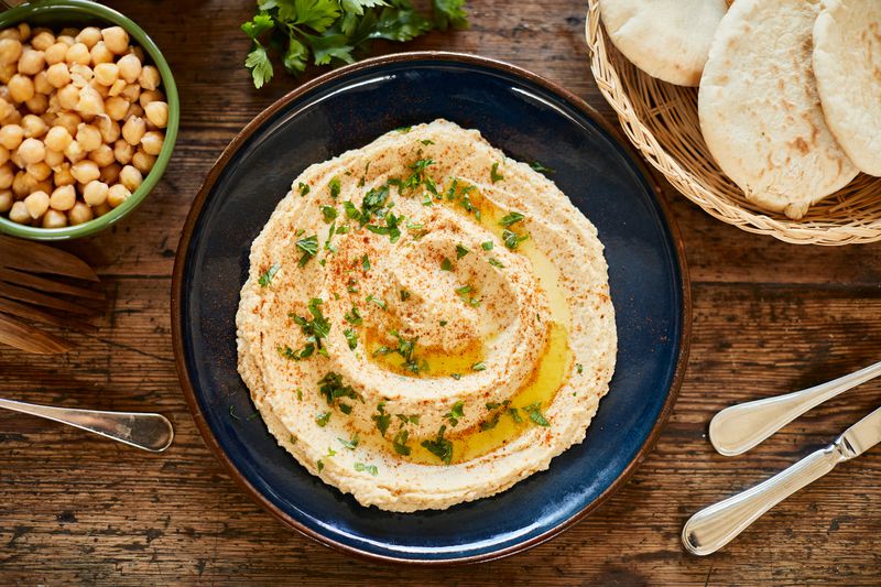 Vegan food, plate with hummus ready to serve.