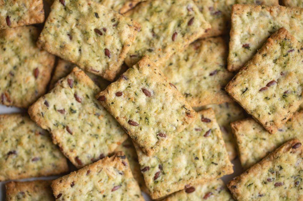 Healthy Snack from Wholegrain Rye Crispbread Crackers with spinach and flaxseed and olive oil