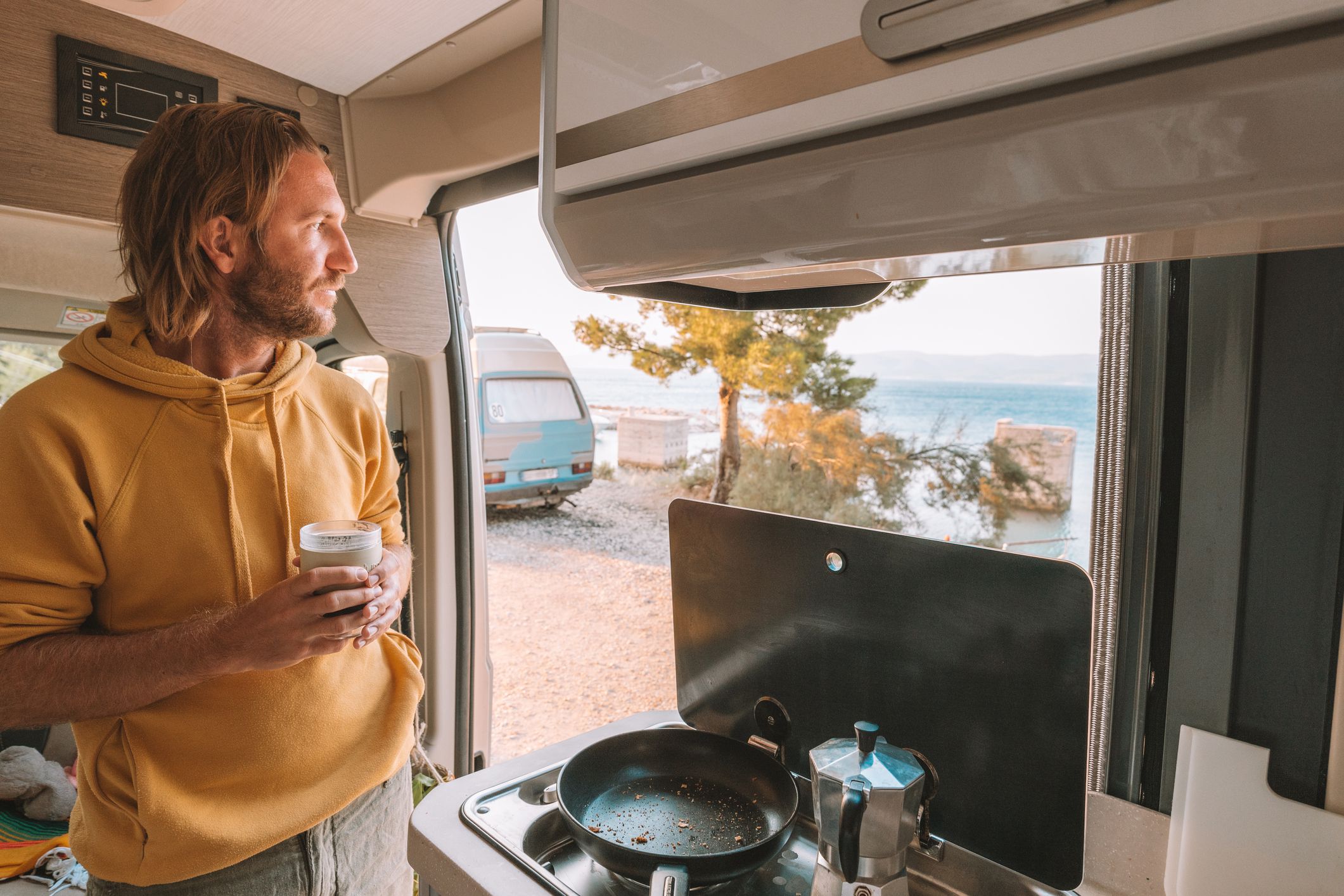 Road trip concept, male living the van life experience.Dalmatian coast, Croatia
