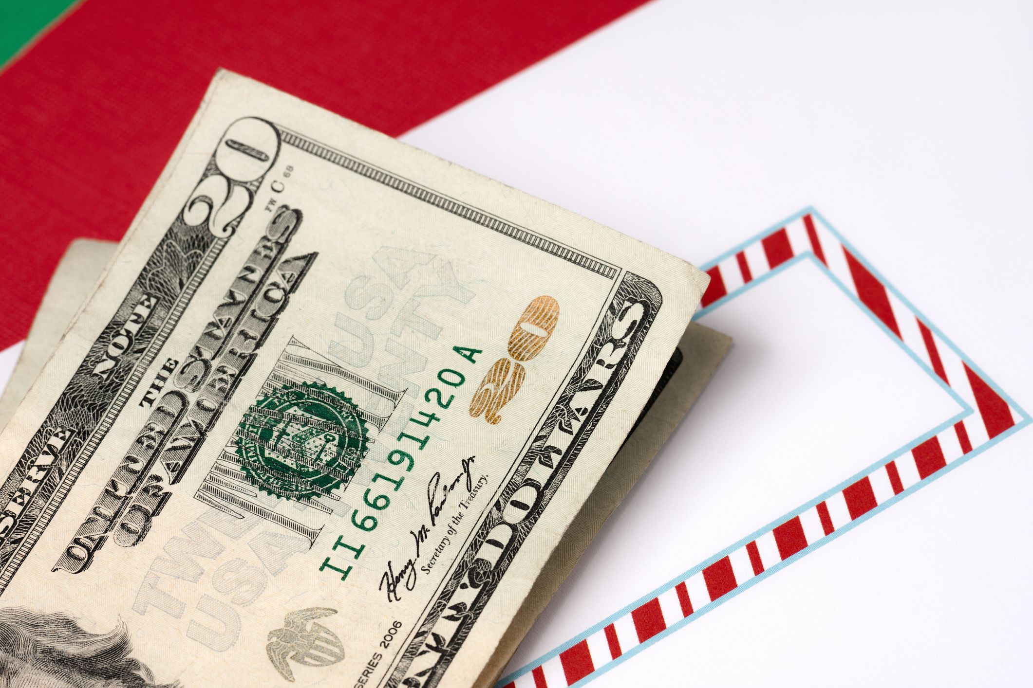 $20 bill over envelope