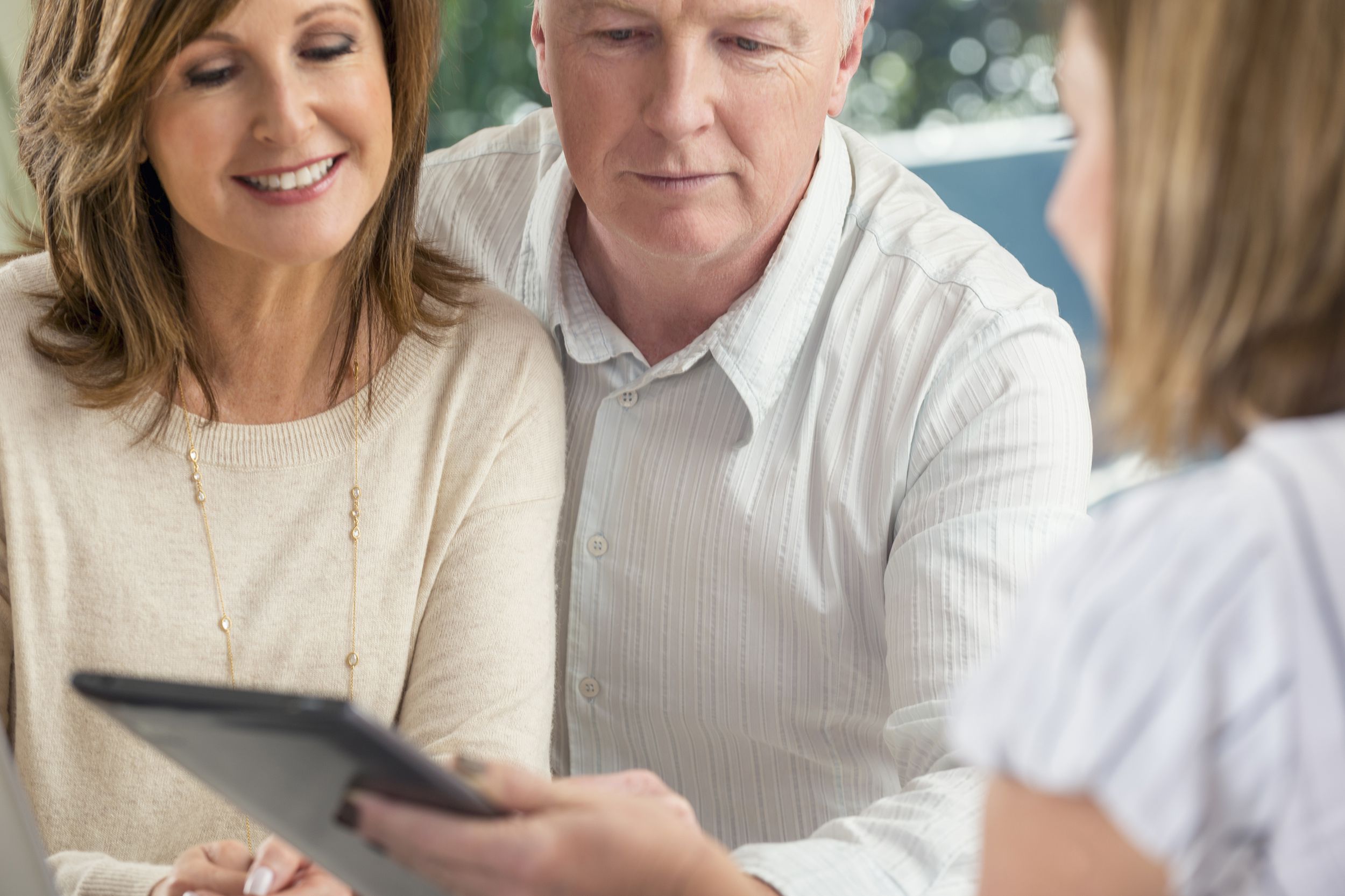 senior couple meeting with financial advisor