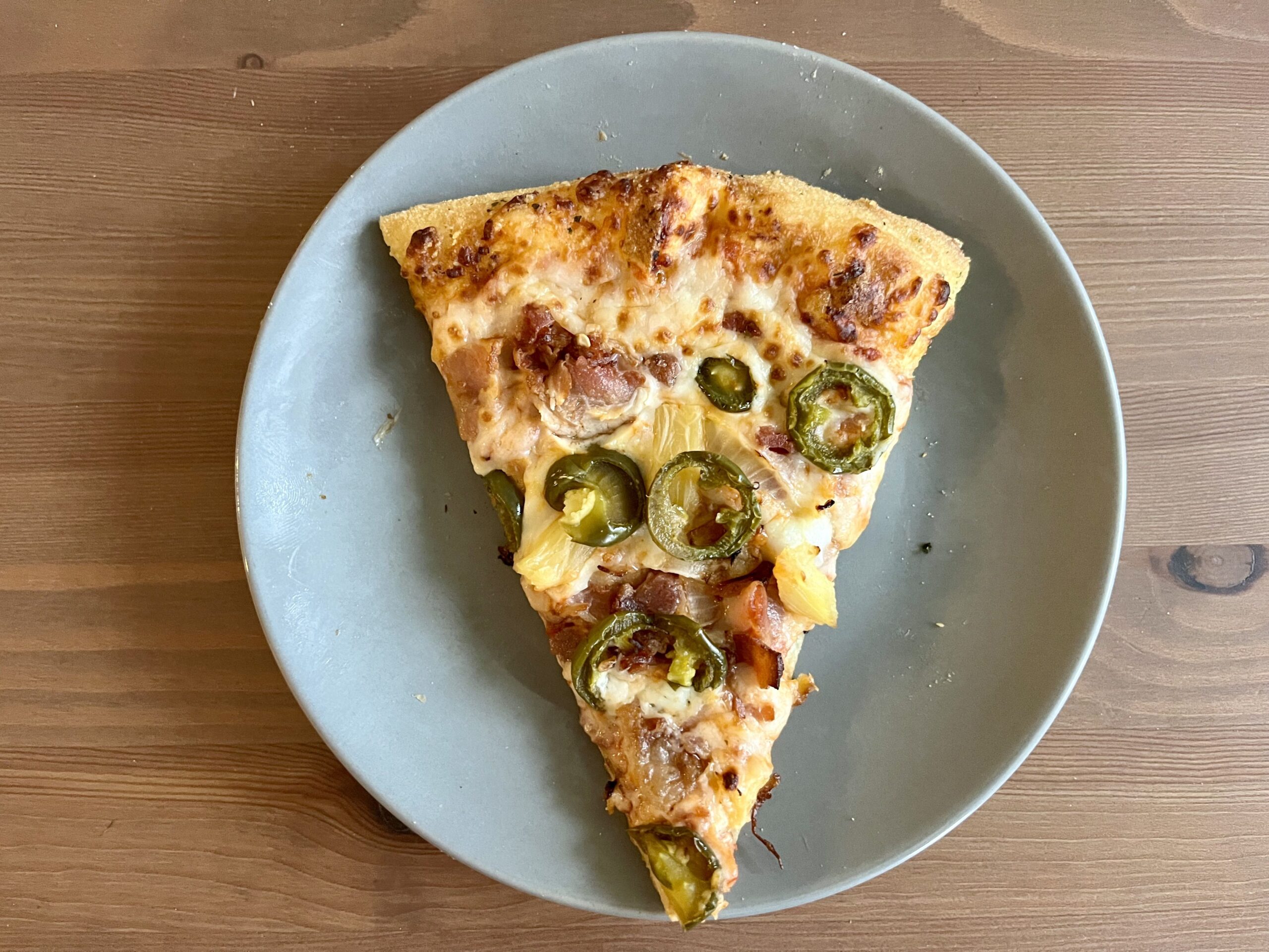 a slice of pizza reheated in a pan