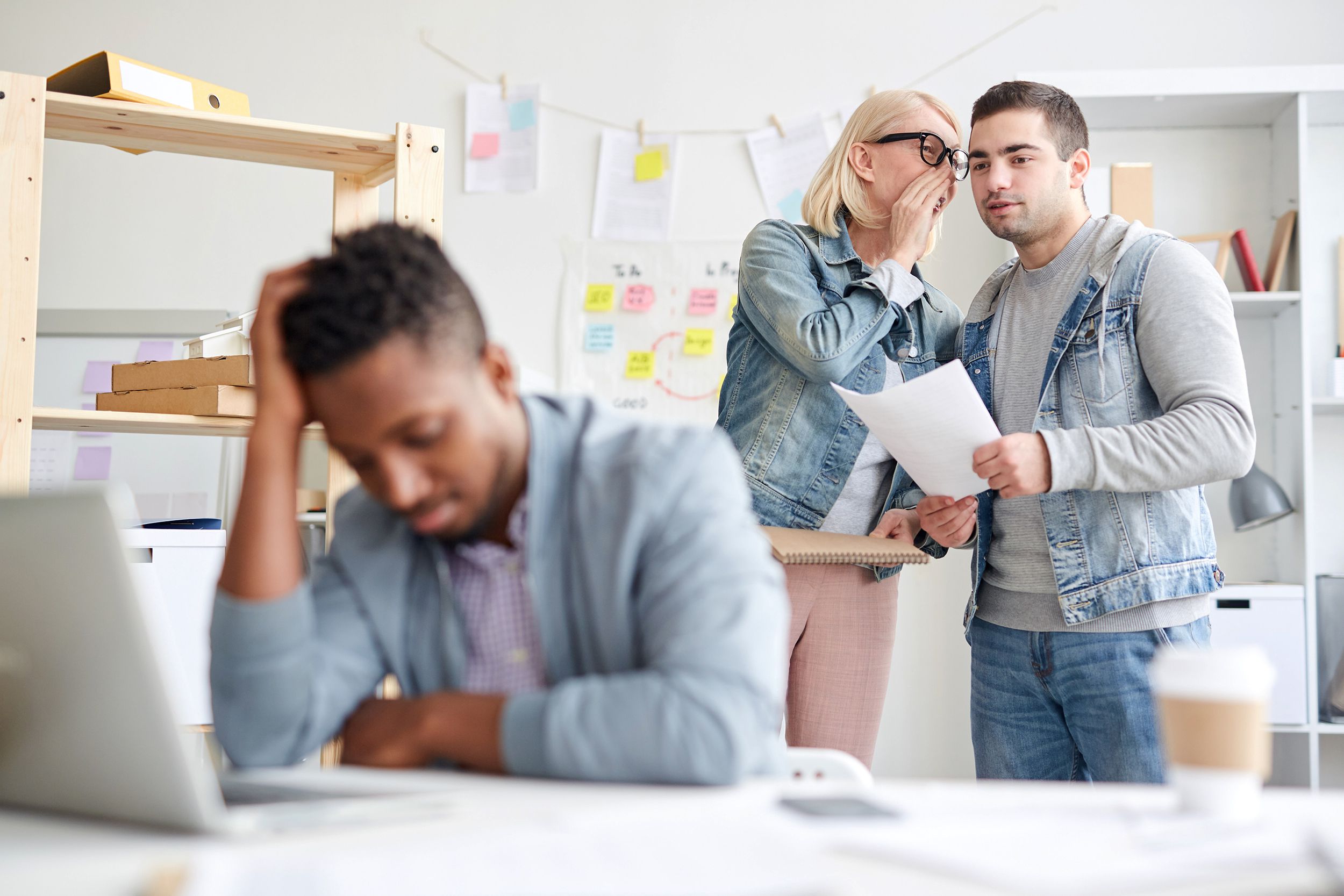 office colleagues gossiping about new employee
