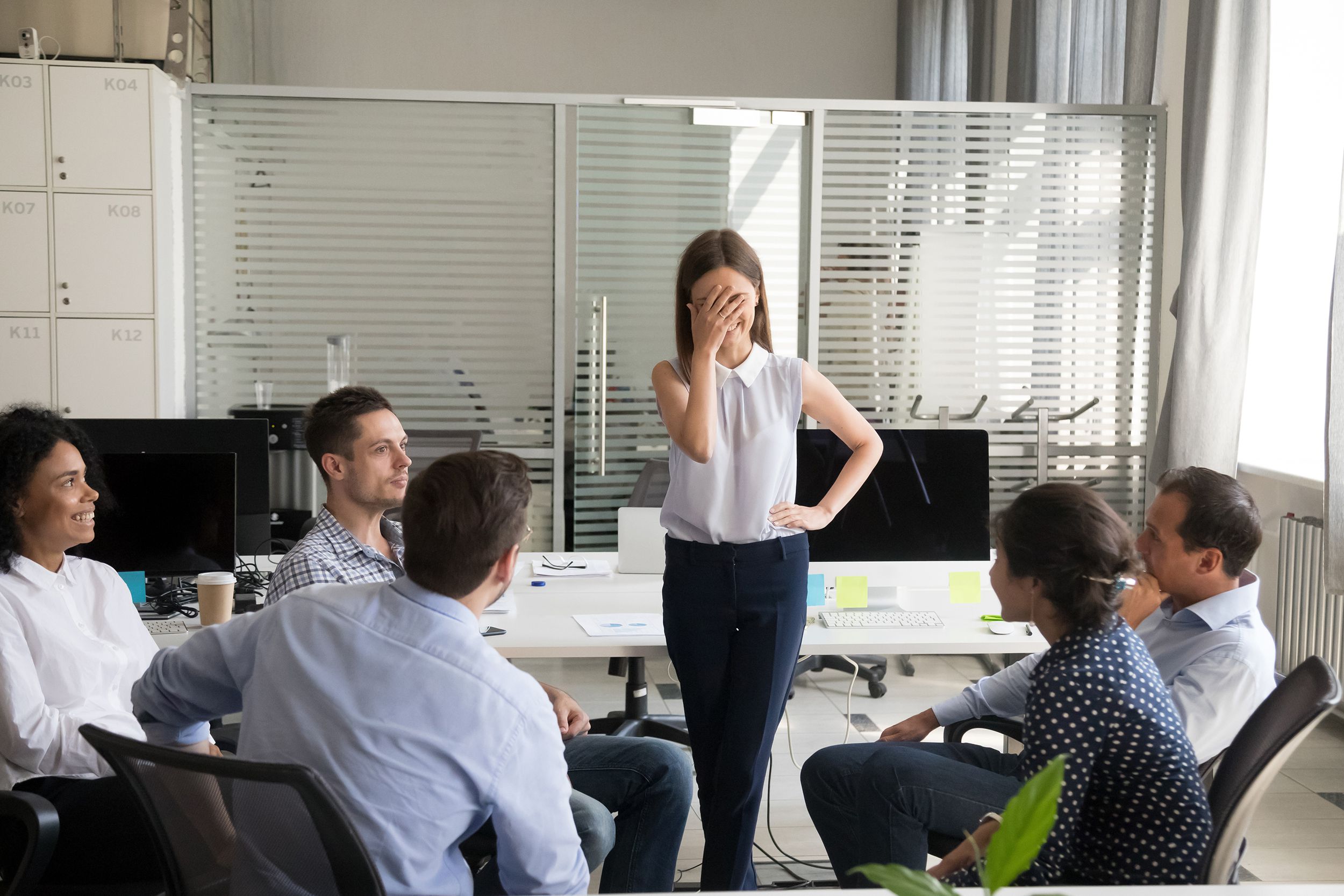 shy nervous worker embarrassed afraid of speaking at corporate meeting