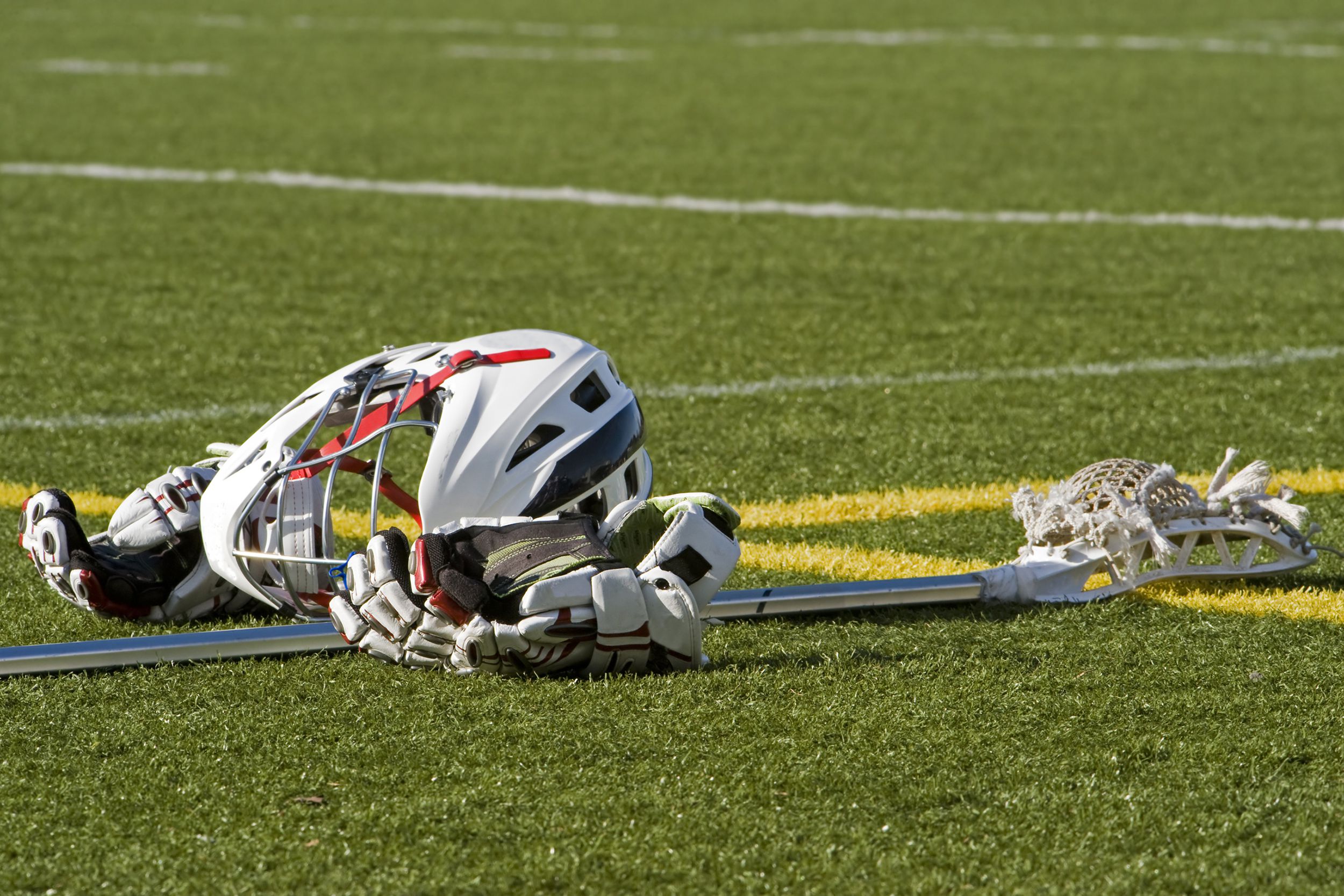 lacrosse gear on turf