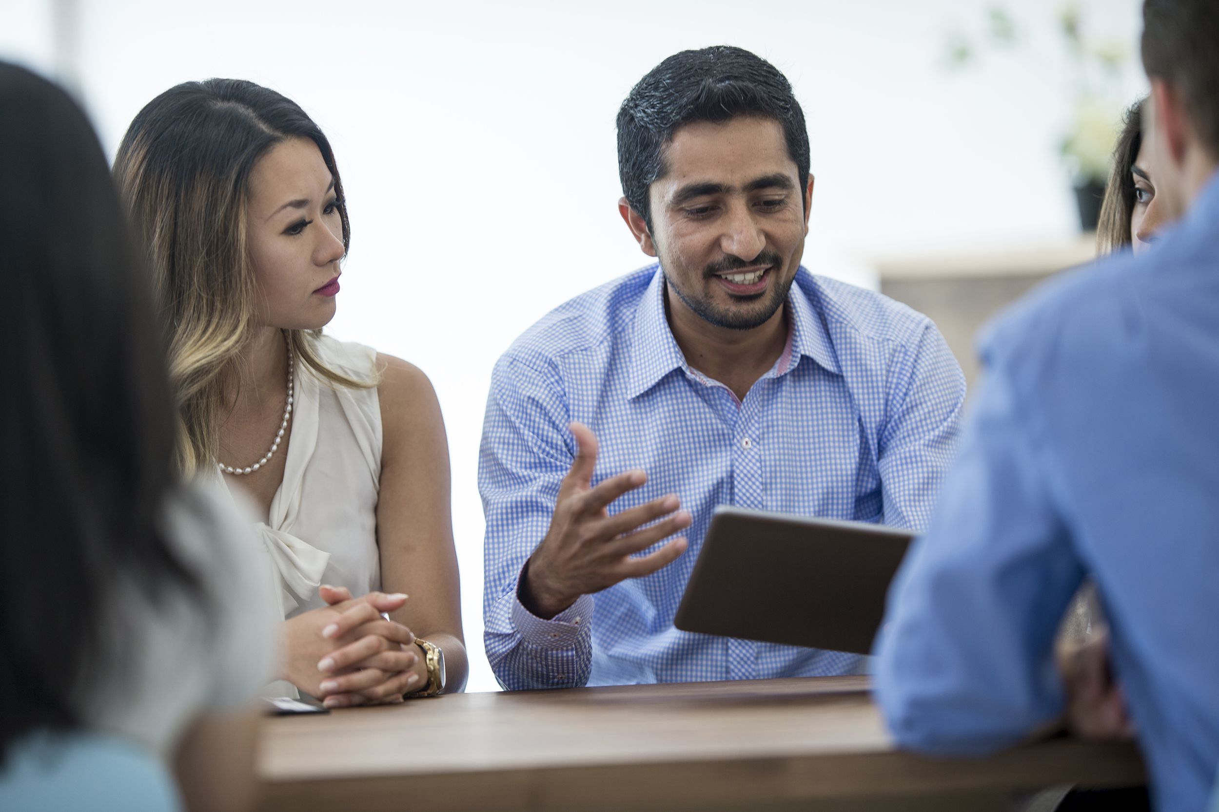 Canadians talking in a work meeting