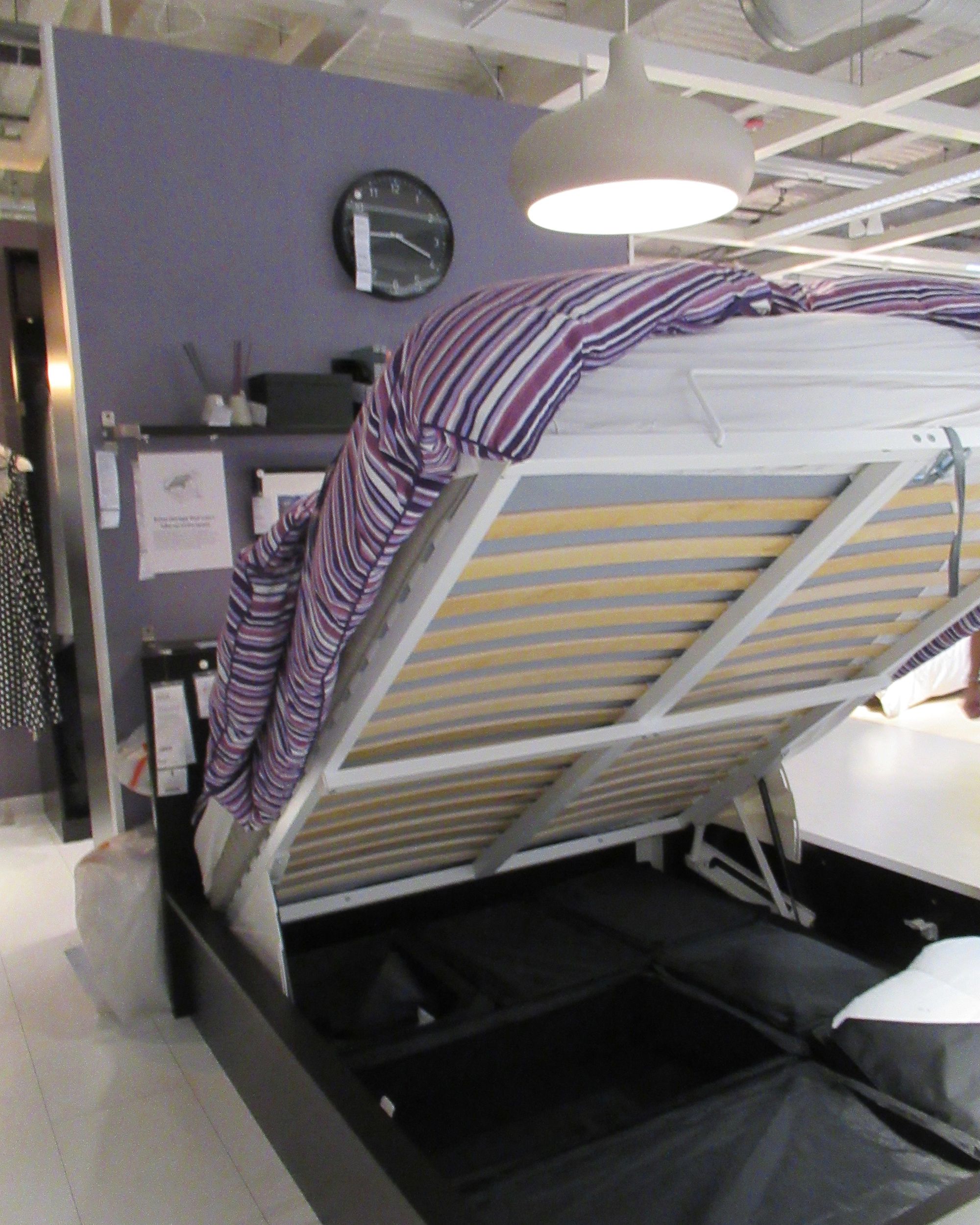 bed elevated, showing storage area underneath