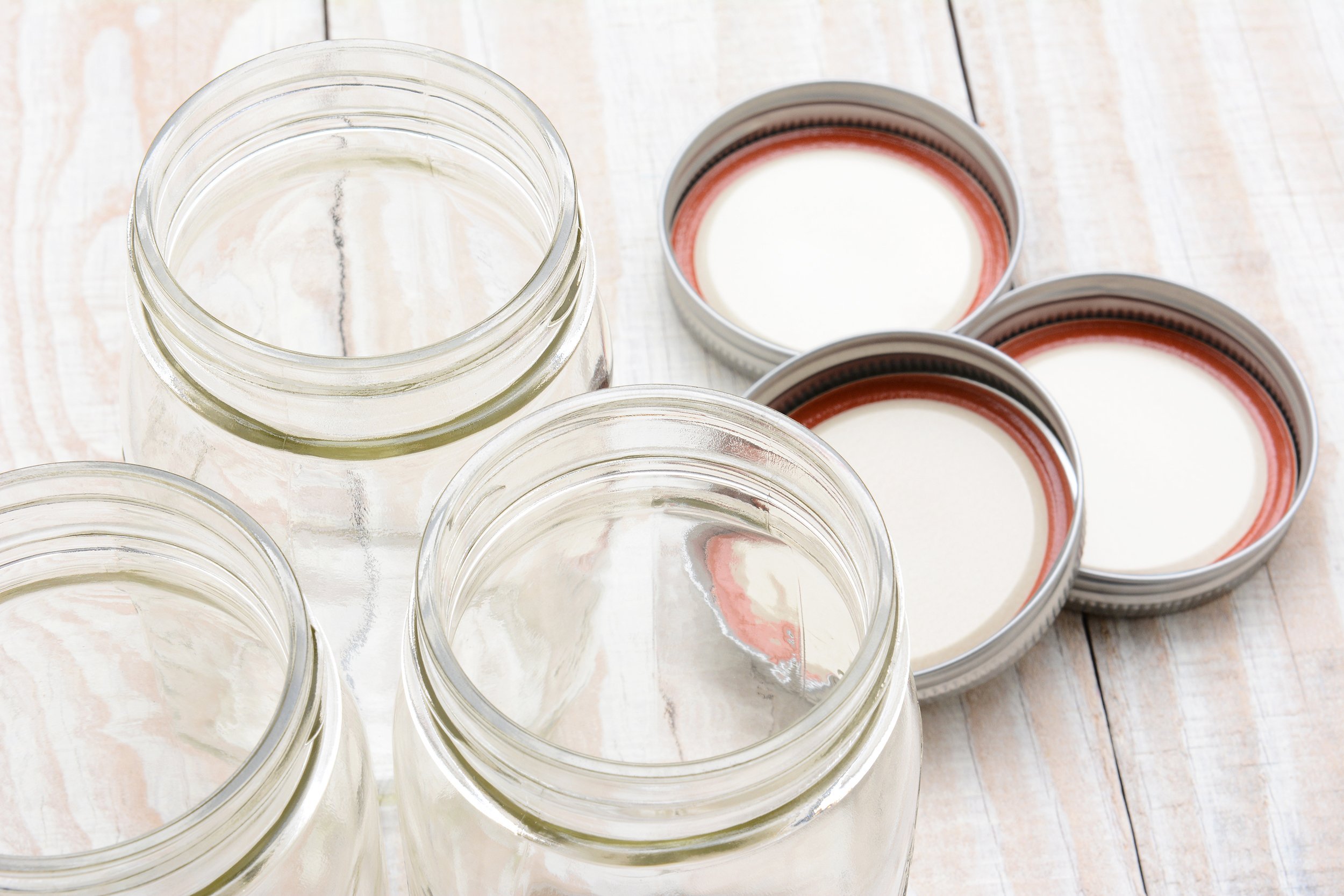 three glass canning jars on kitchen table