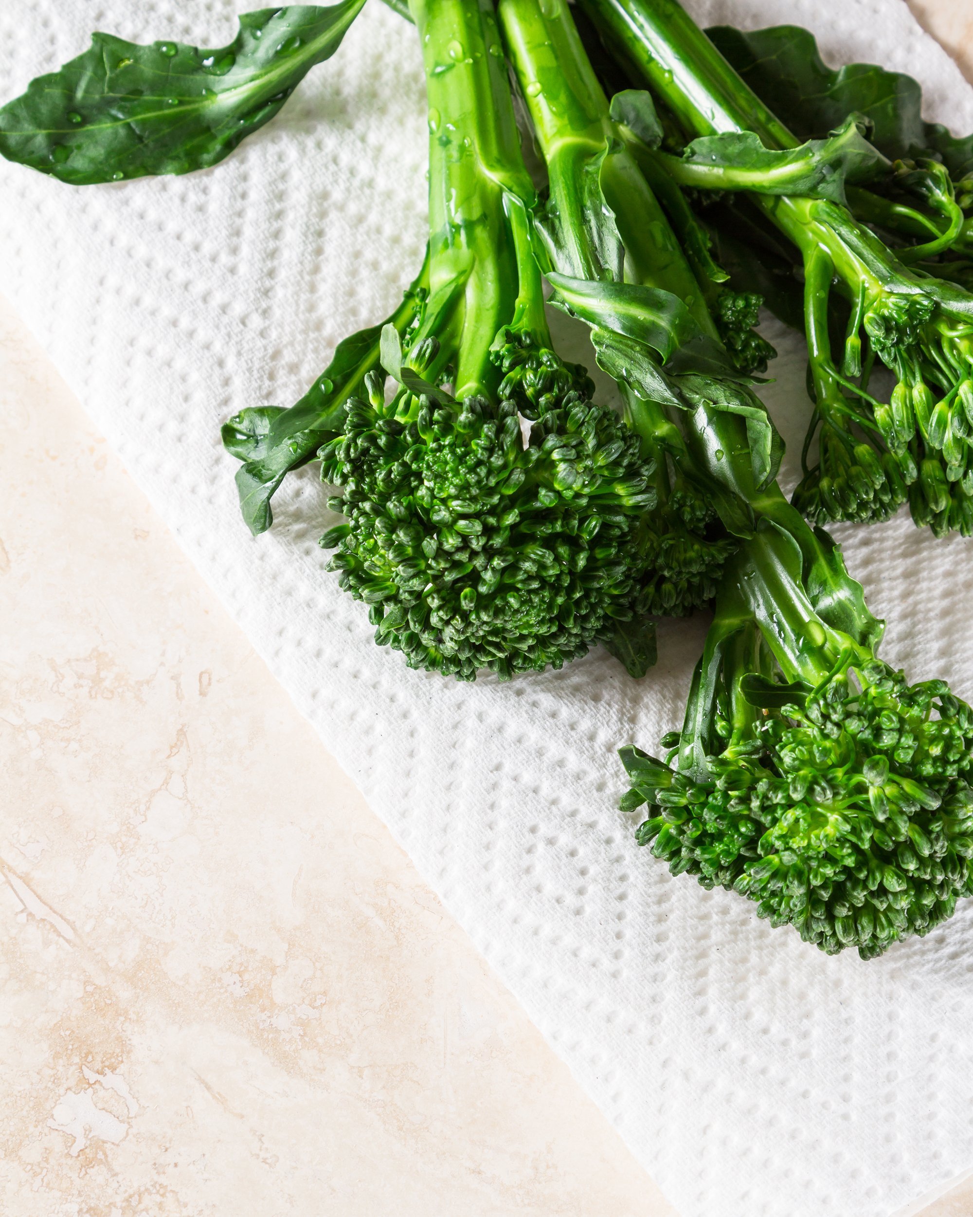 broccolini placed on a white paper towel