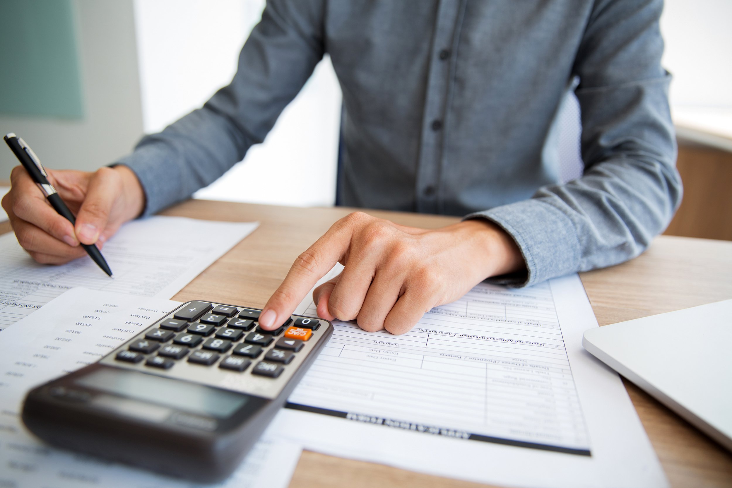 Man at home organizing his budget