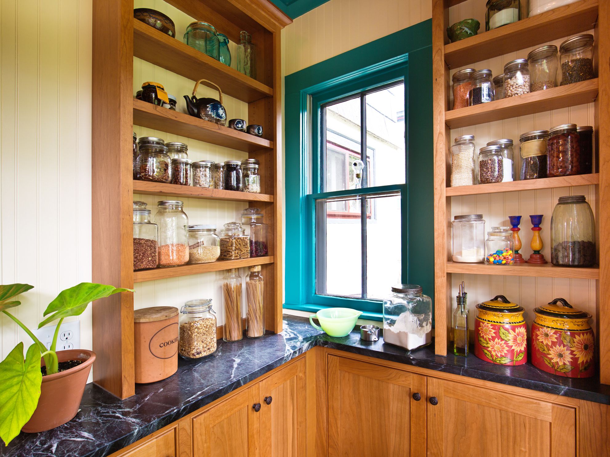 A contemporary classic kitchen renovation remodeling featuring a pantry storage shelf and maple cabinet.