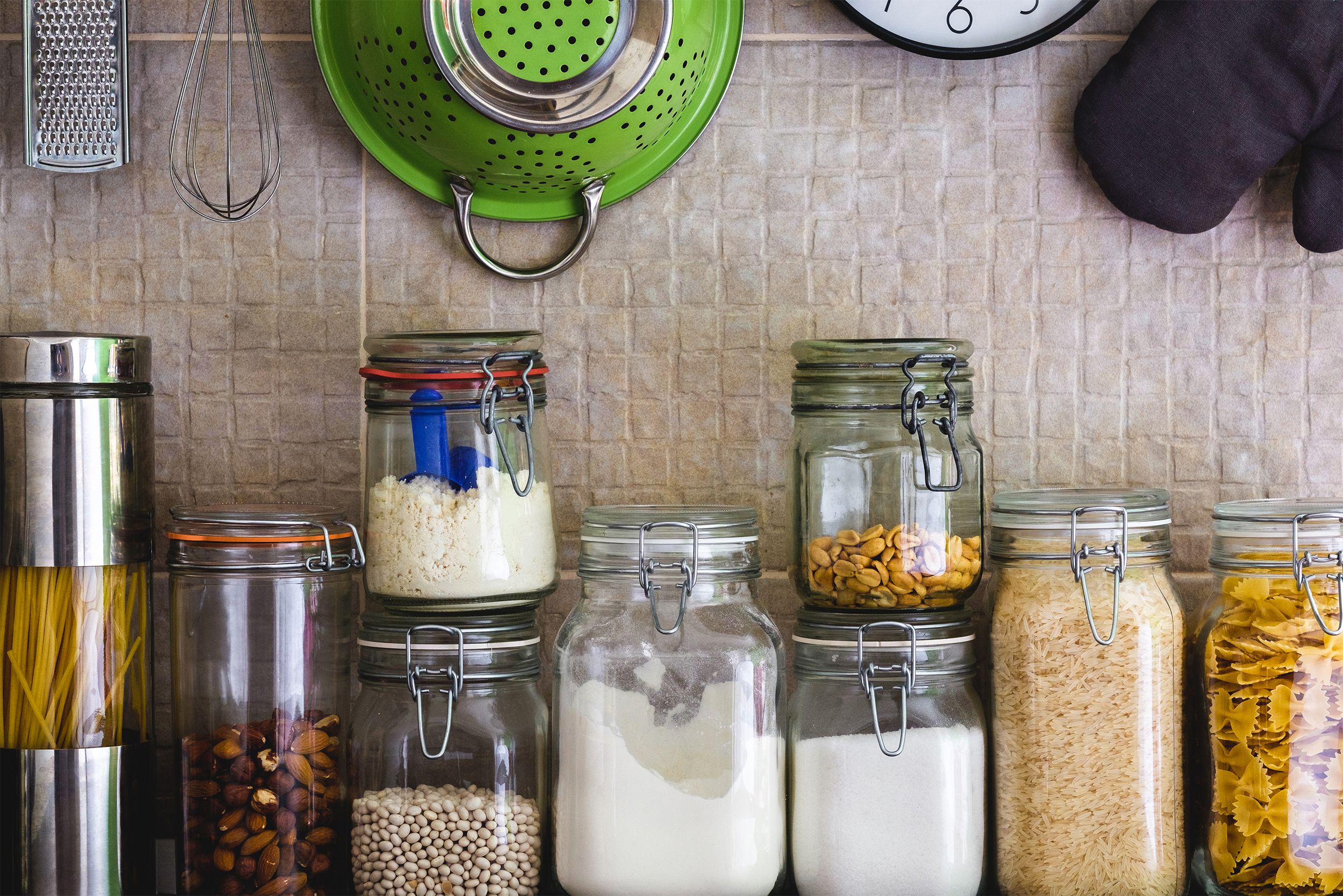Various dried ingredients in glass jars on the kitchen counter