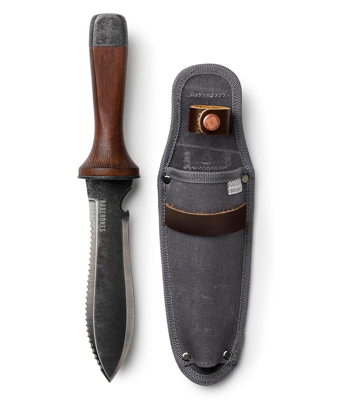 A survival knife with a dark wooden handle and serrated edge is shown next to its gray sheath, which has a leather strap and a small pocket holding a sharpening stone.