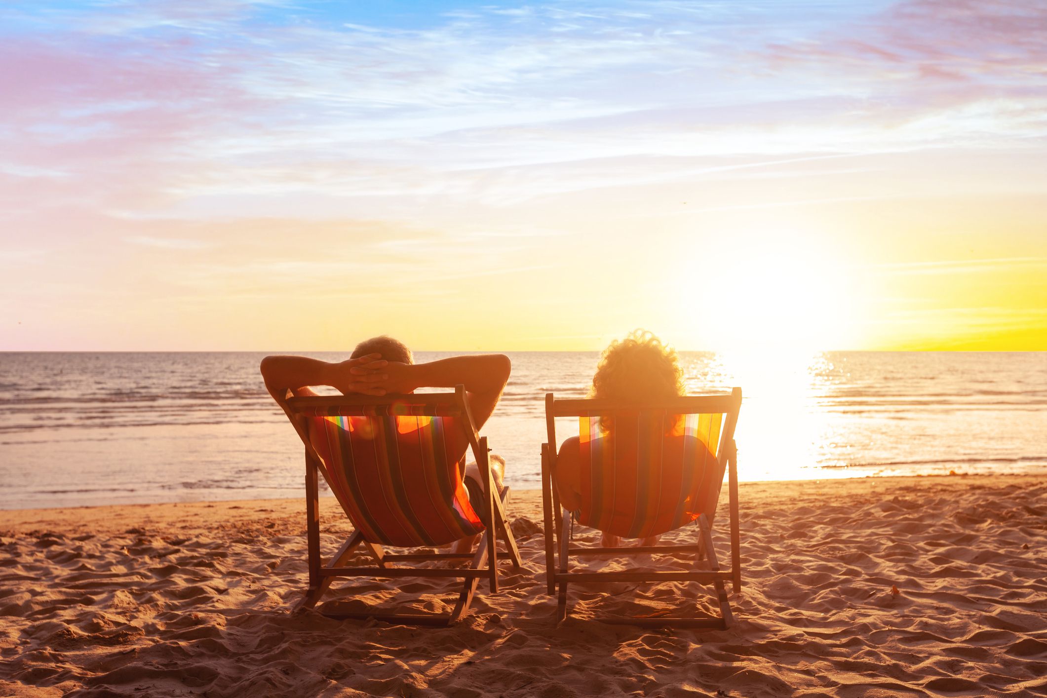 summer holidays, beach travel, vacation for couple, man and woman relax and enjoy life together at sunset