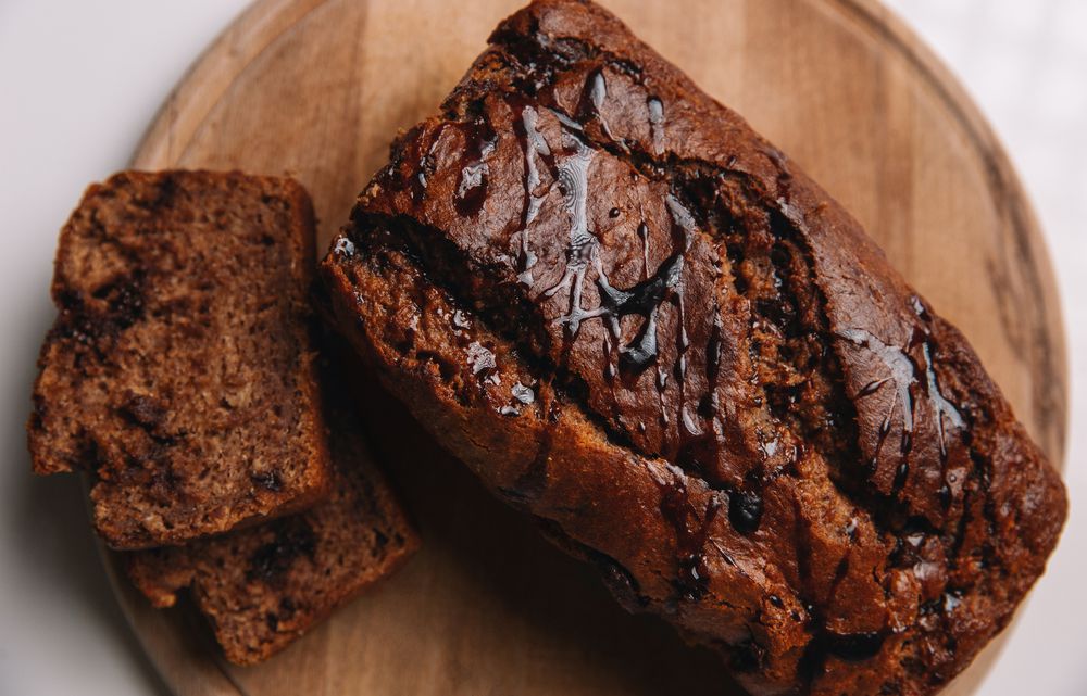 Sliced homemade banana bread with chocolate, selective focus, top view