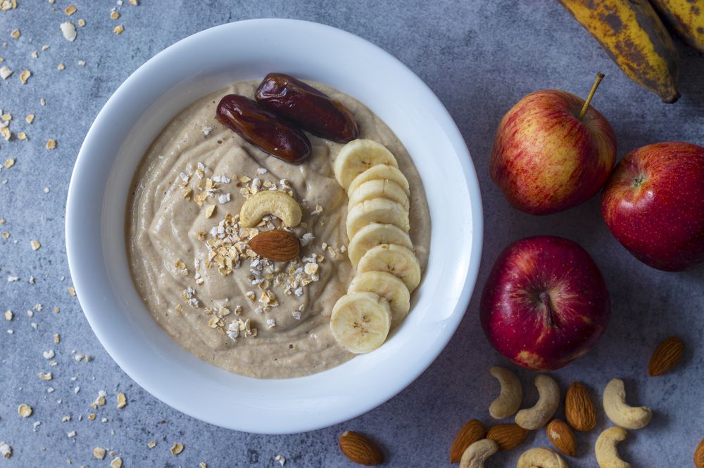 healthy food oats banana smoothie with fruits and nuts.