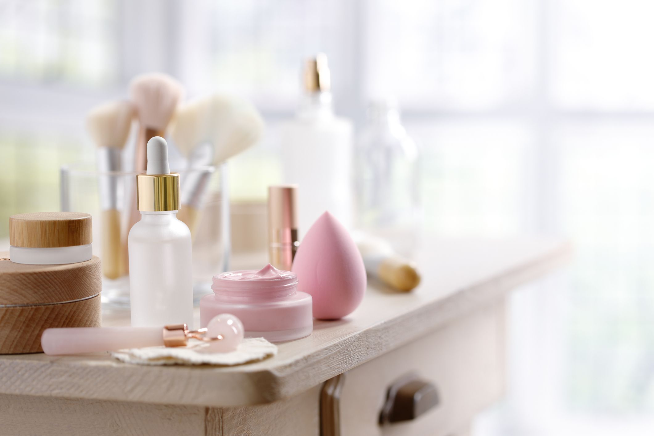 Little rustic table with skin care and make-up equipment