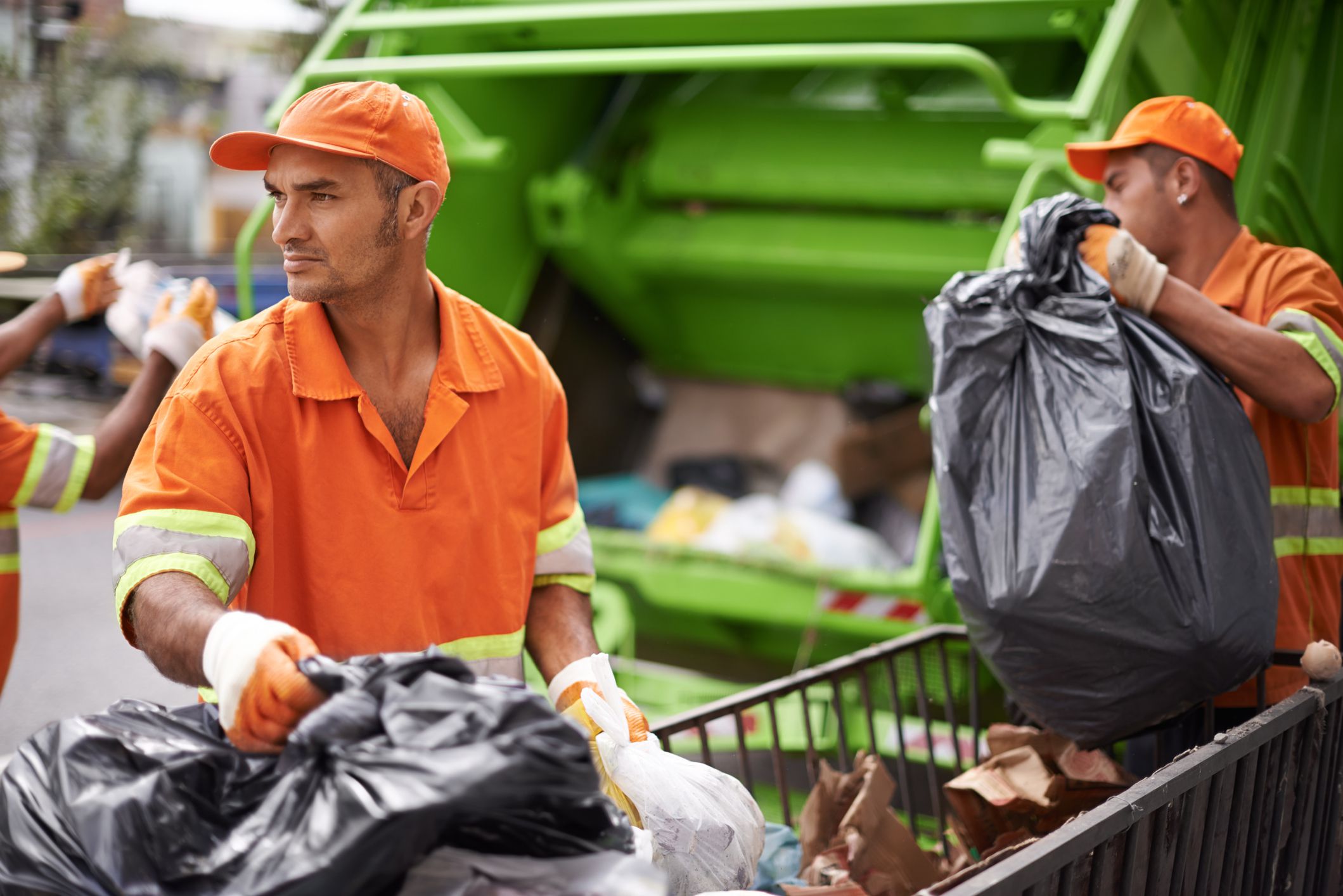 Cropped shot of a garbage collection team at work