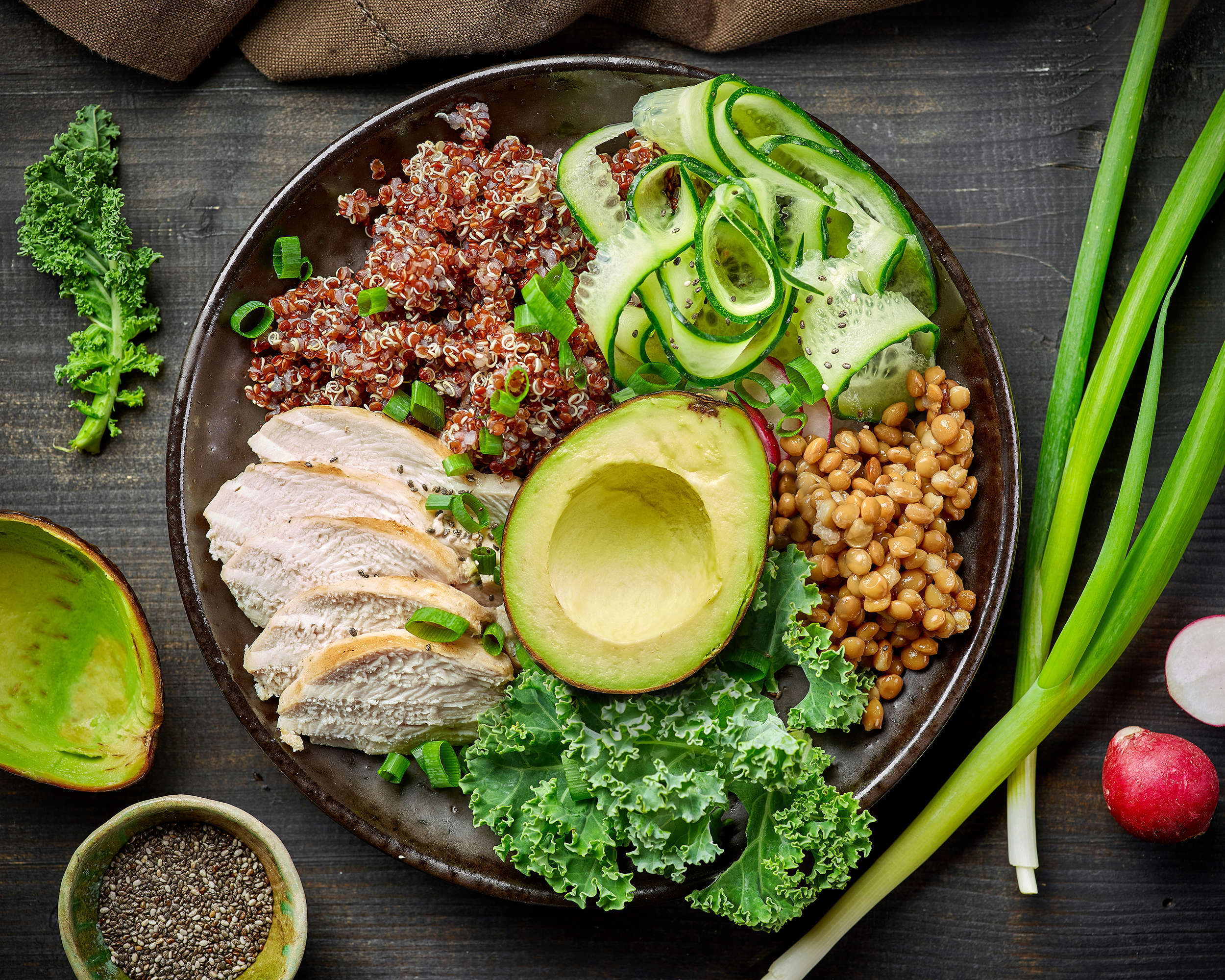 Healthy bowl with grains, avocado, and chicken