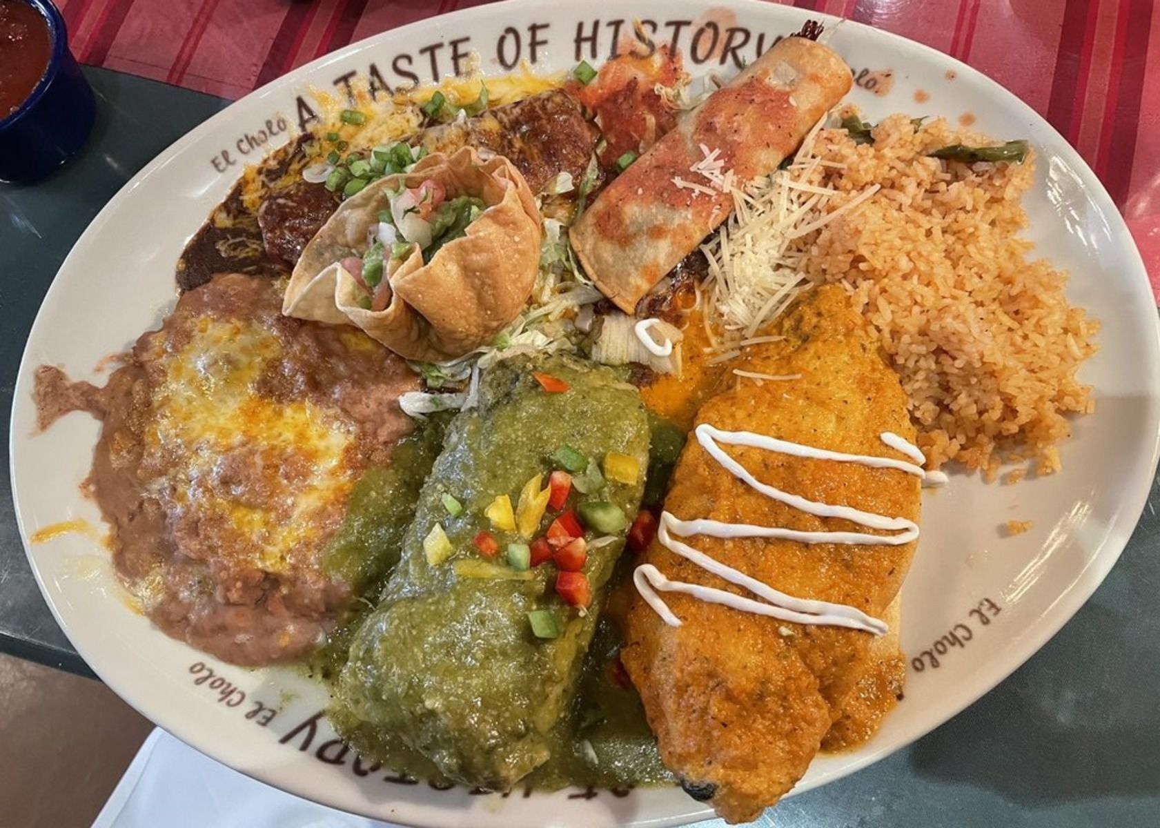 A Taste of History on a white plate with ‘A Taste of History’ wording, El Cholo, Los Angeles, on a table at the restaurant
