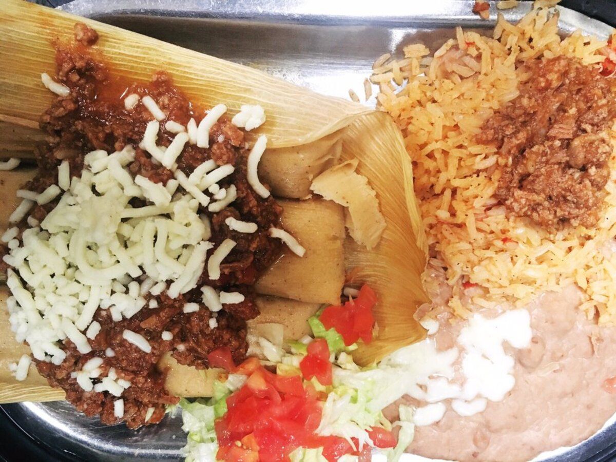 Closeup of Pork Tamales with sides on a metal serving plate, Ruiz Mexican Restaurant, Florissant, Missouri
