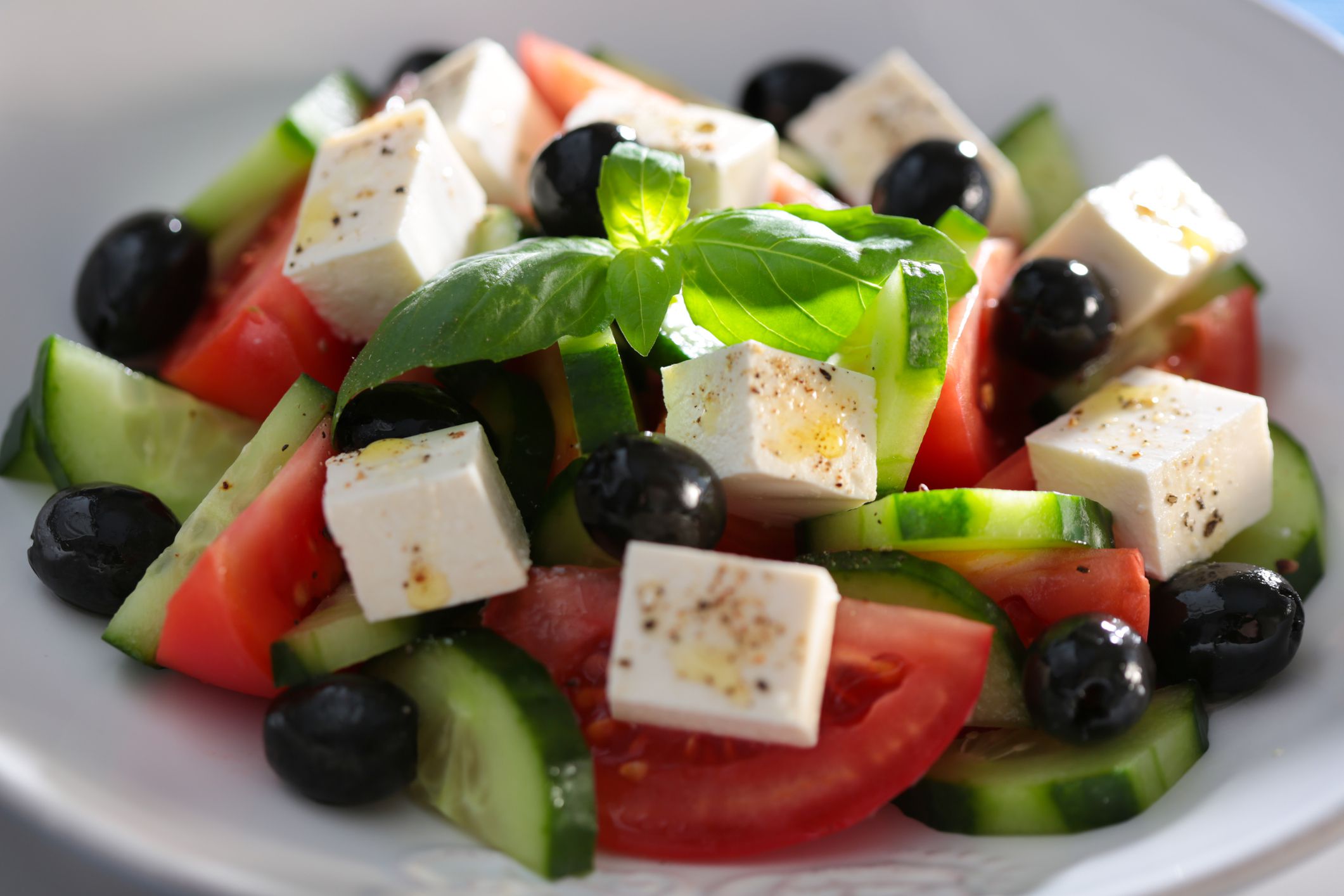 Closeup of Best Greek Salad in a white porcelain bowl