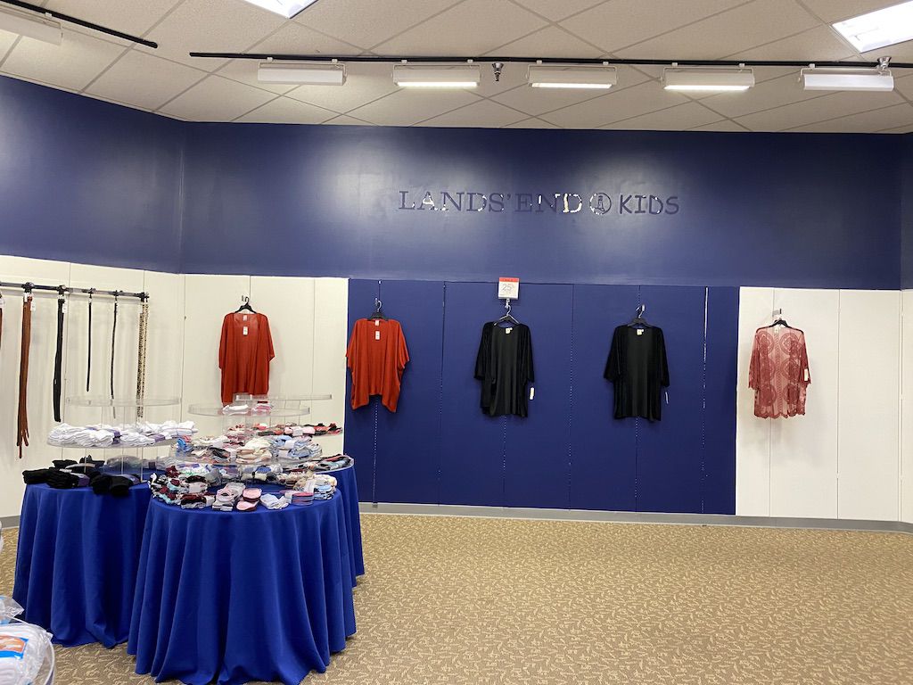 A few red and black tops hanging in Glenburnie Sears
