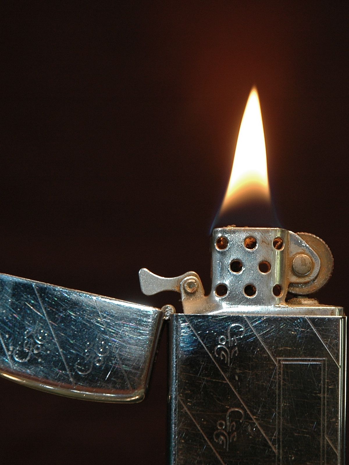 A lit slim model Zippo