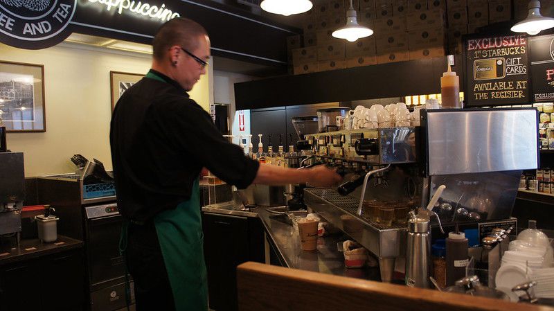 Barista working at Pike Place Starbucks in Seattle