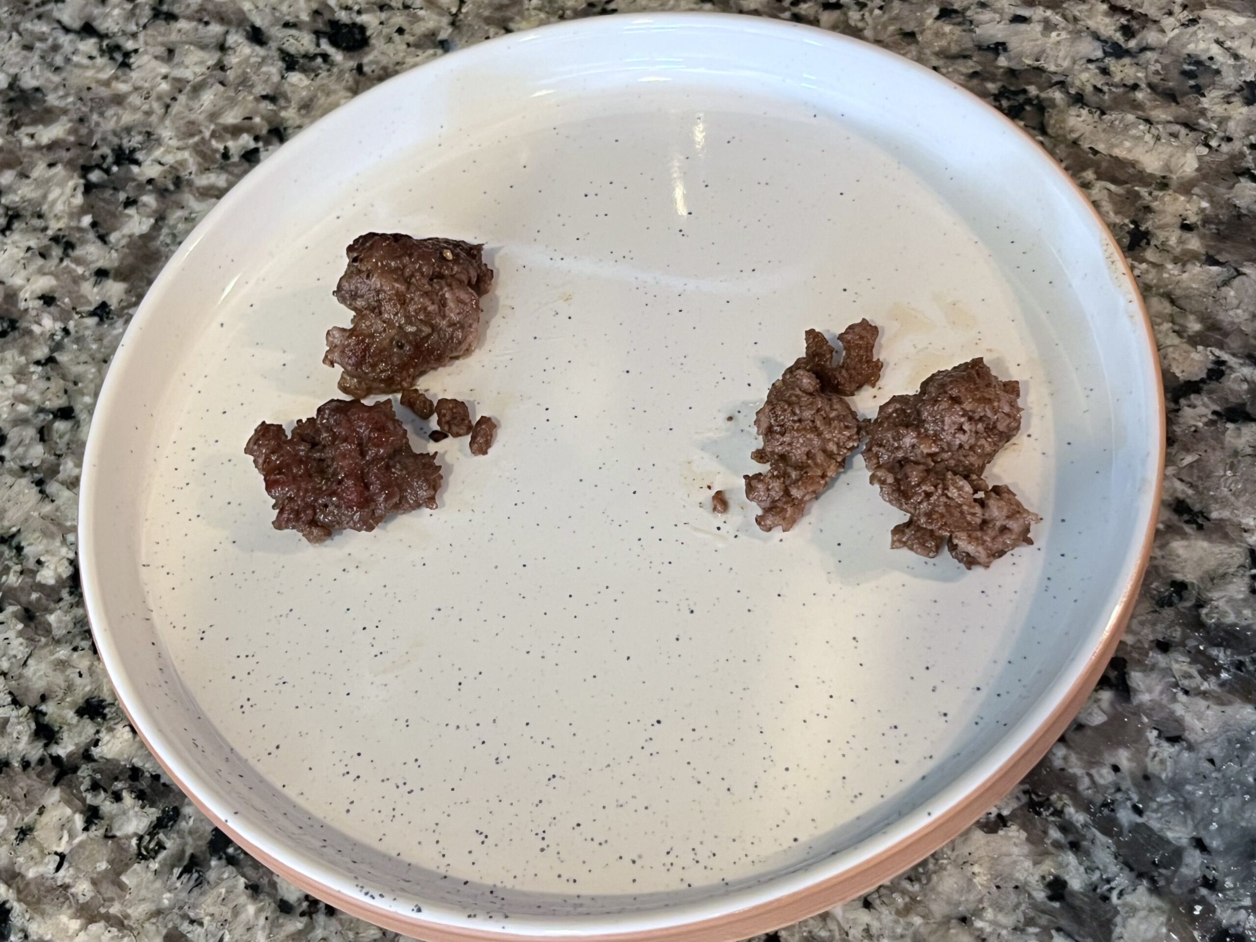 two types of ground beef side by side on a plate