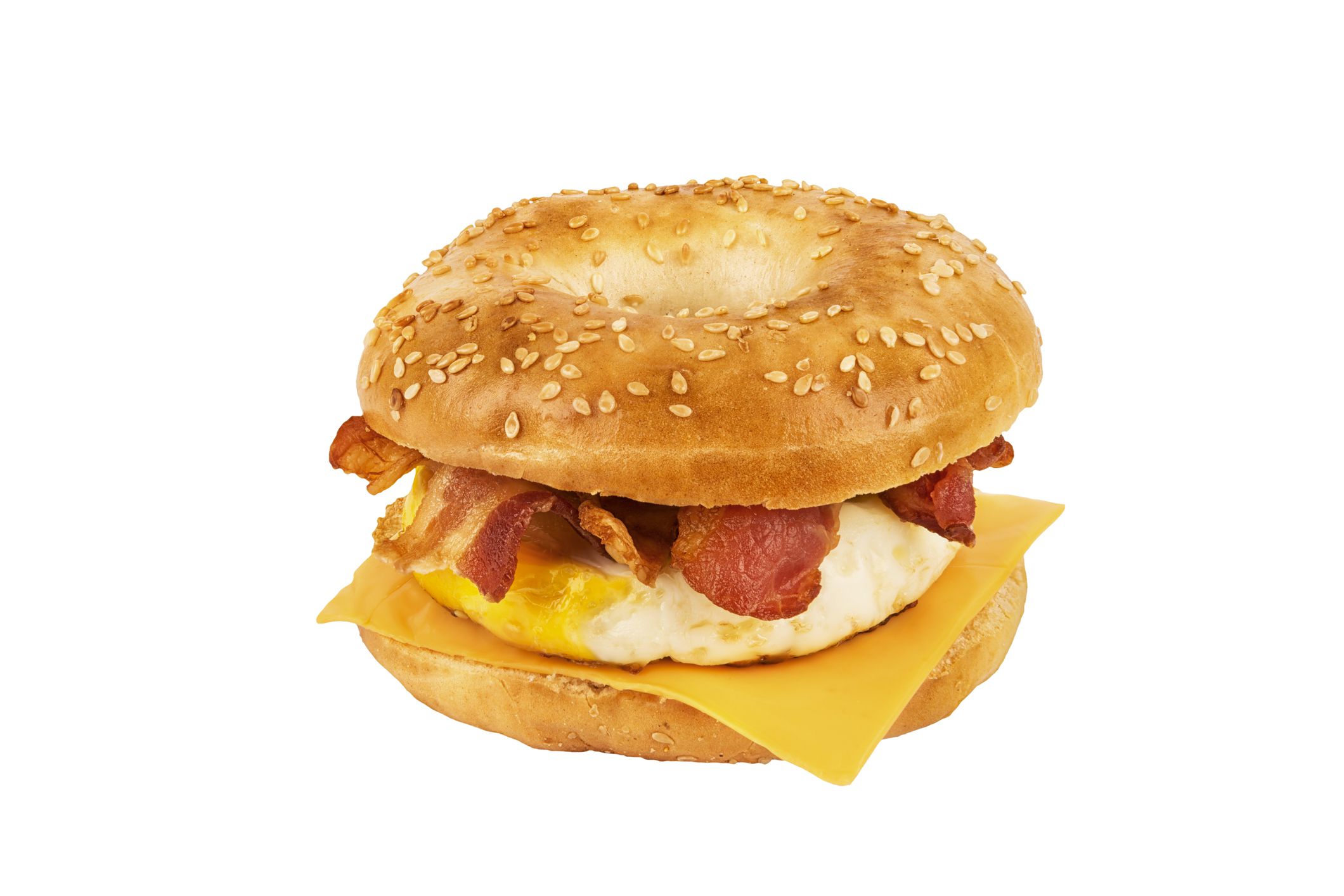 Close up on a sandwich breakfast isolated on white background. Bagel, egg, cheese and bacon.