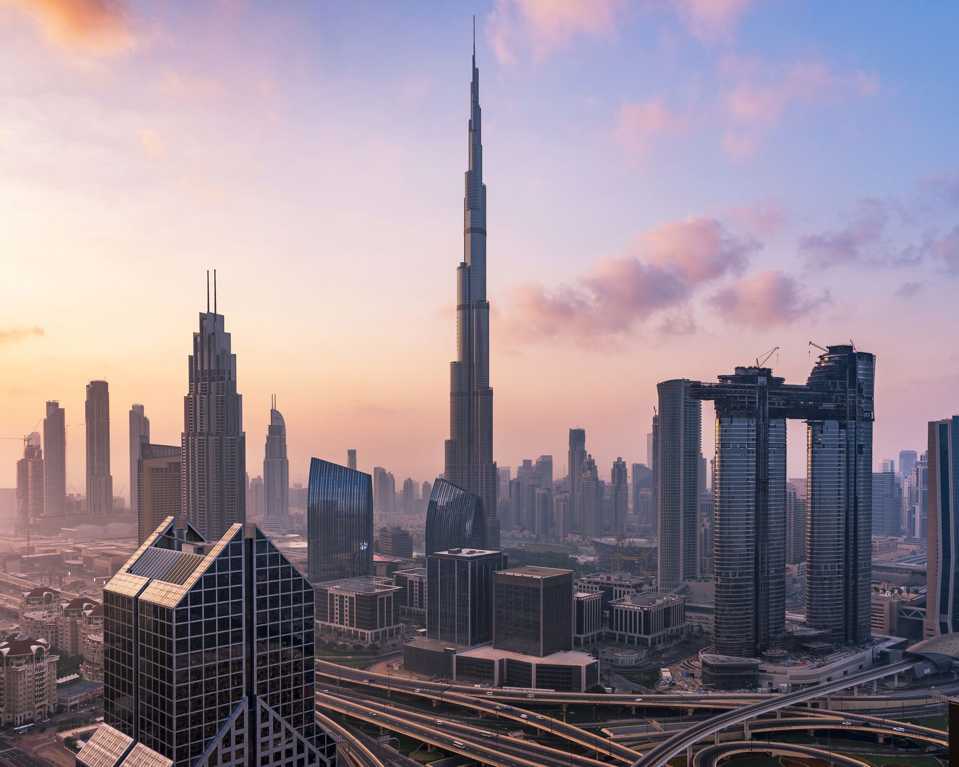Dubai sky line with traffic junction and Burj Khalifa.