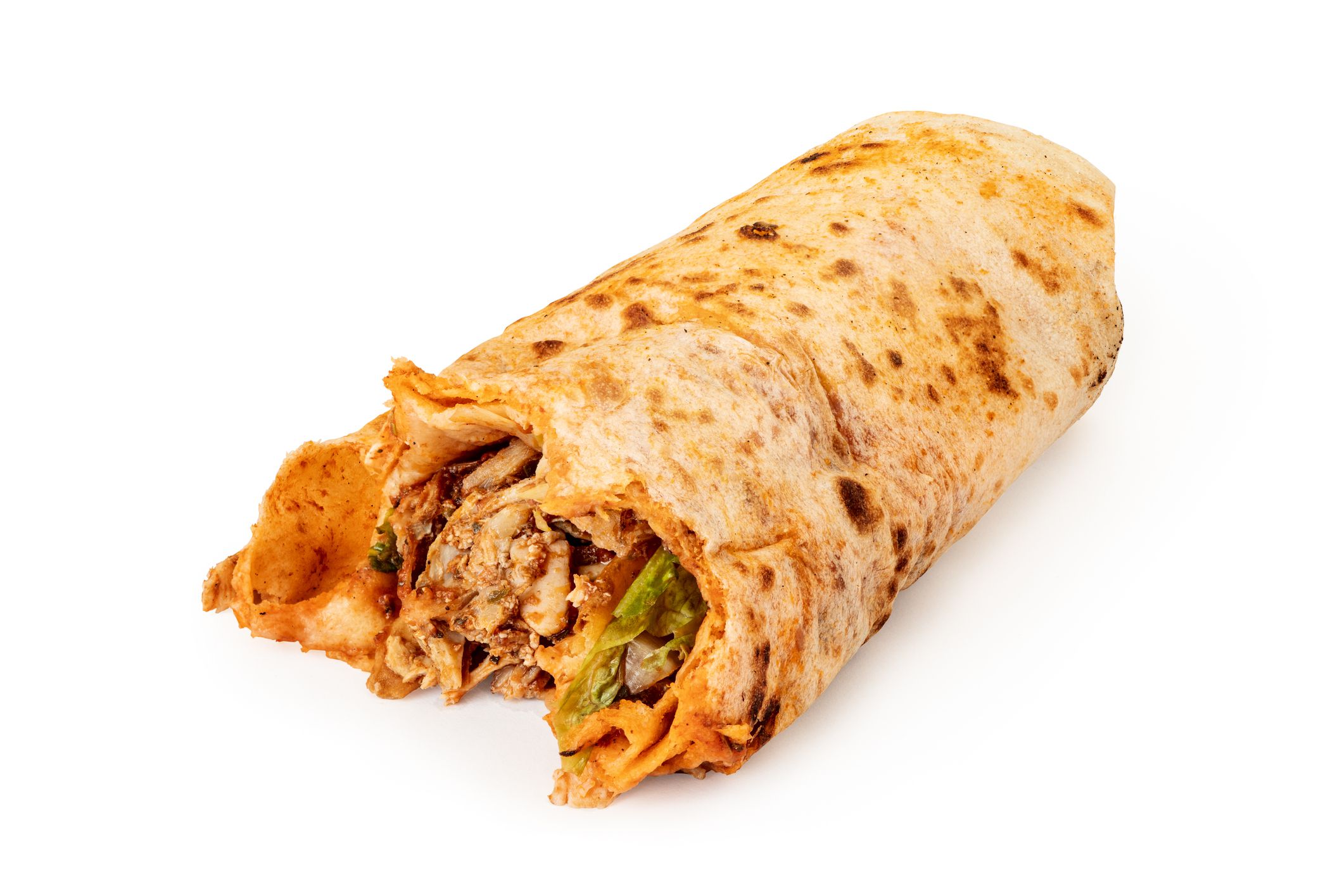 Isolated on a white background, Turkish doner or durum is a fast food with meat and salad wrapped in a flatbread. Unhealthy and greasy food