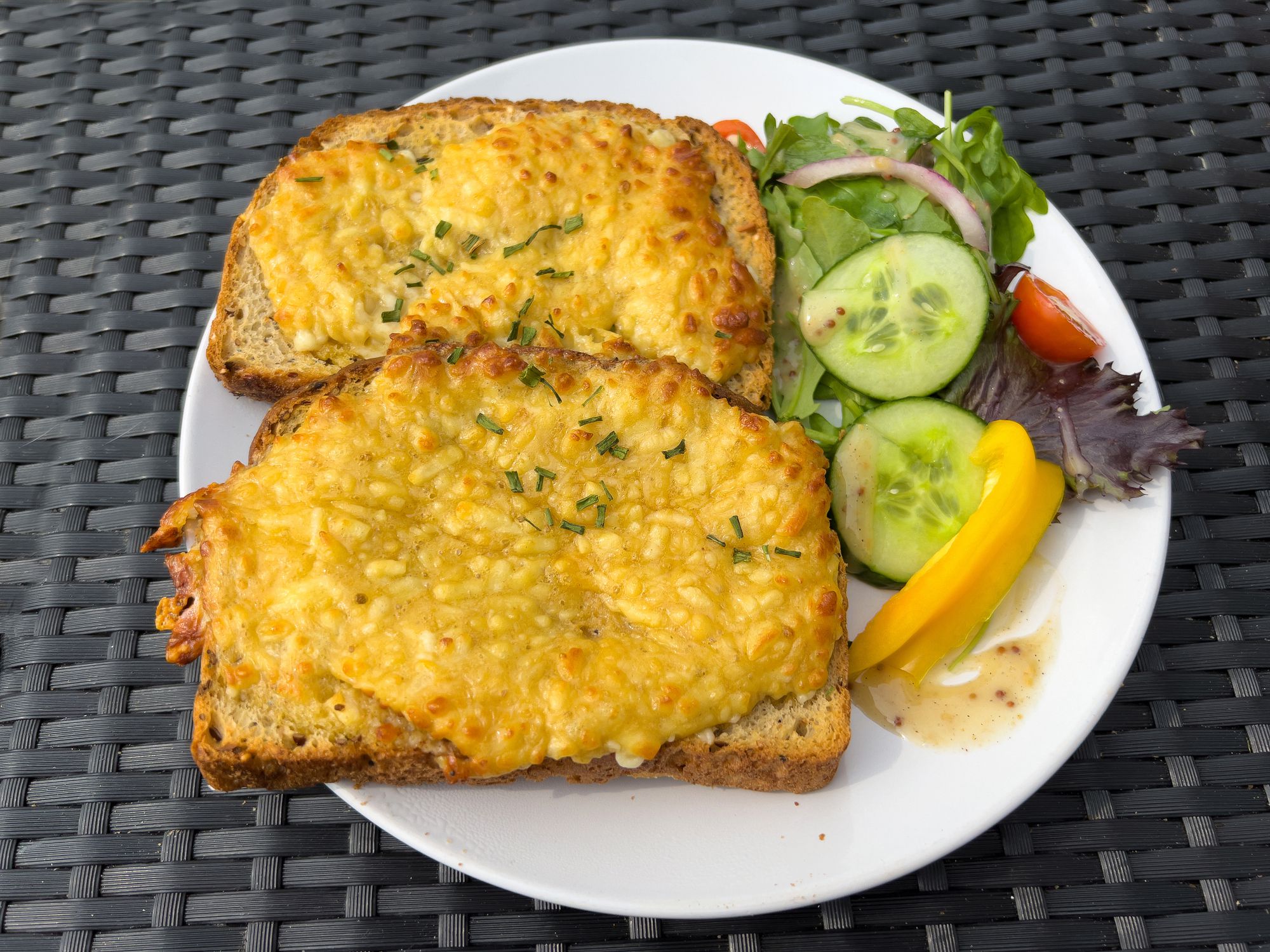 Two slices of Welsh rarebit or cheese on toast