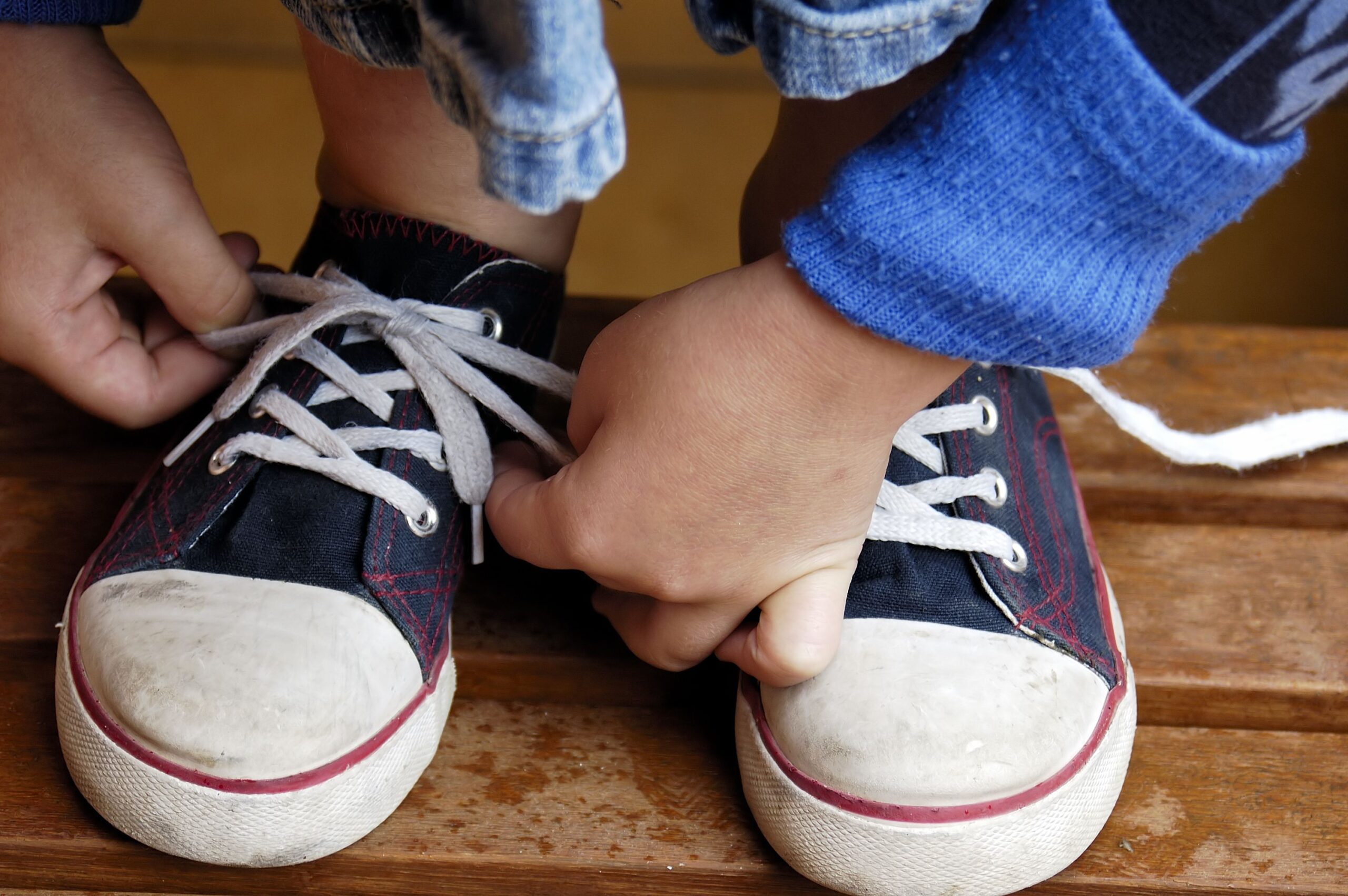 Child's hands tyeing sport shoes.More of this & other kids atBEING A KID LIGHTBOX