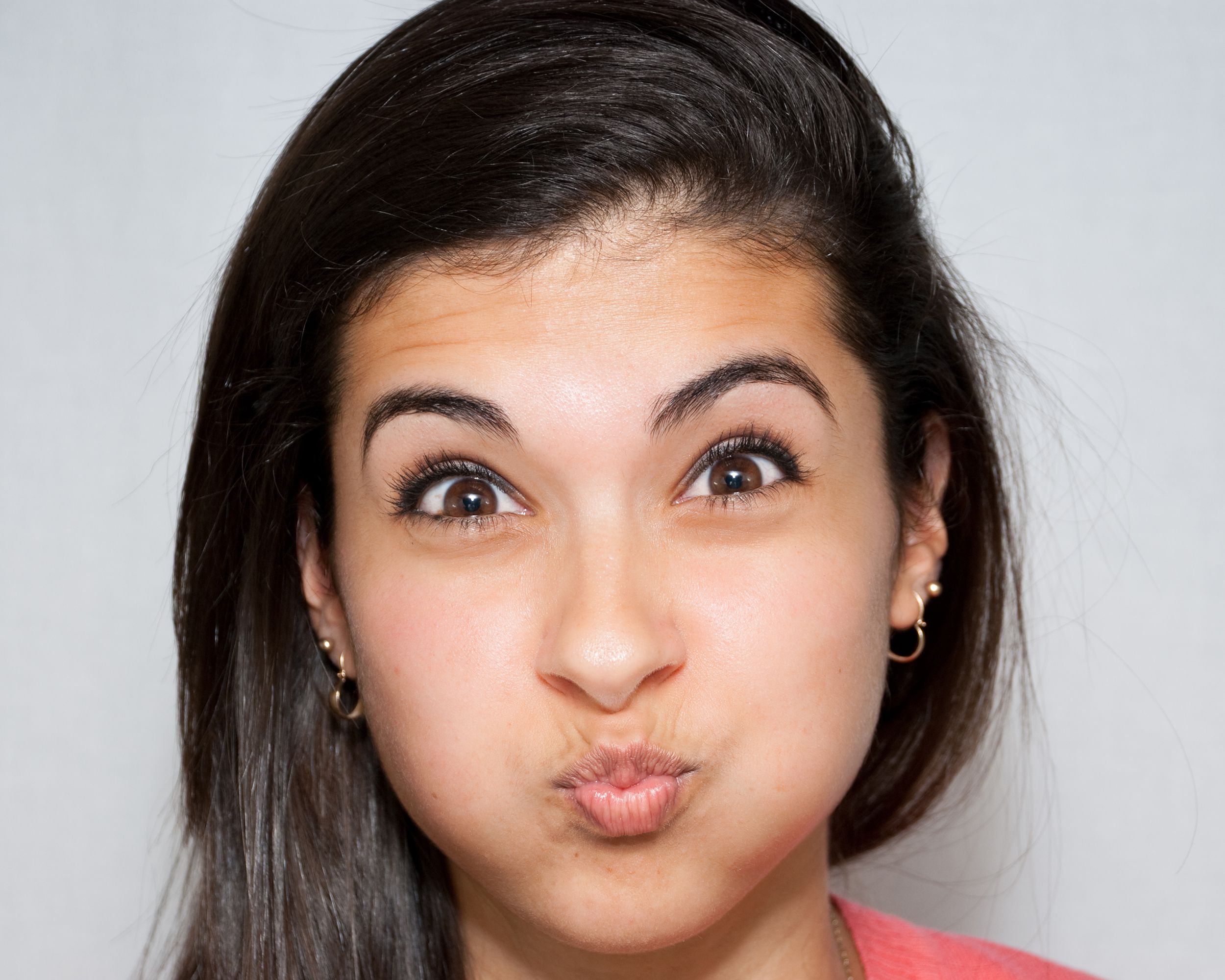 young woman holding her breath
