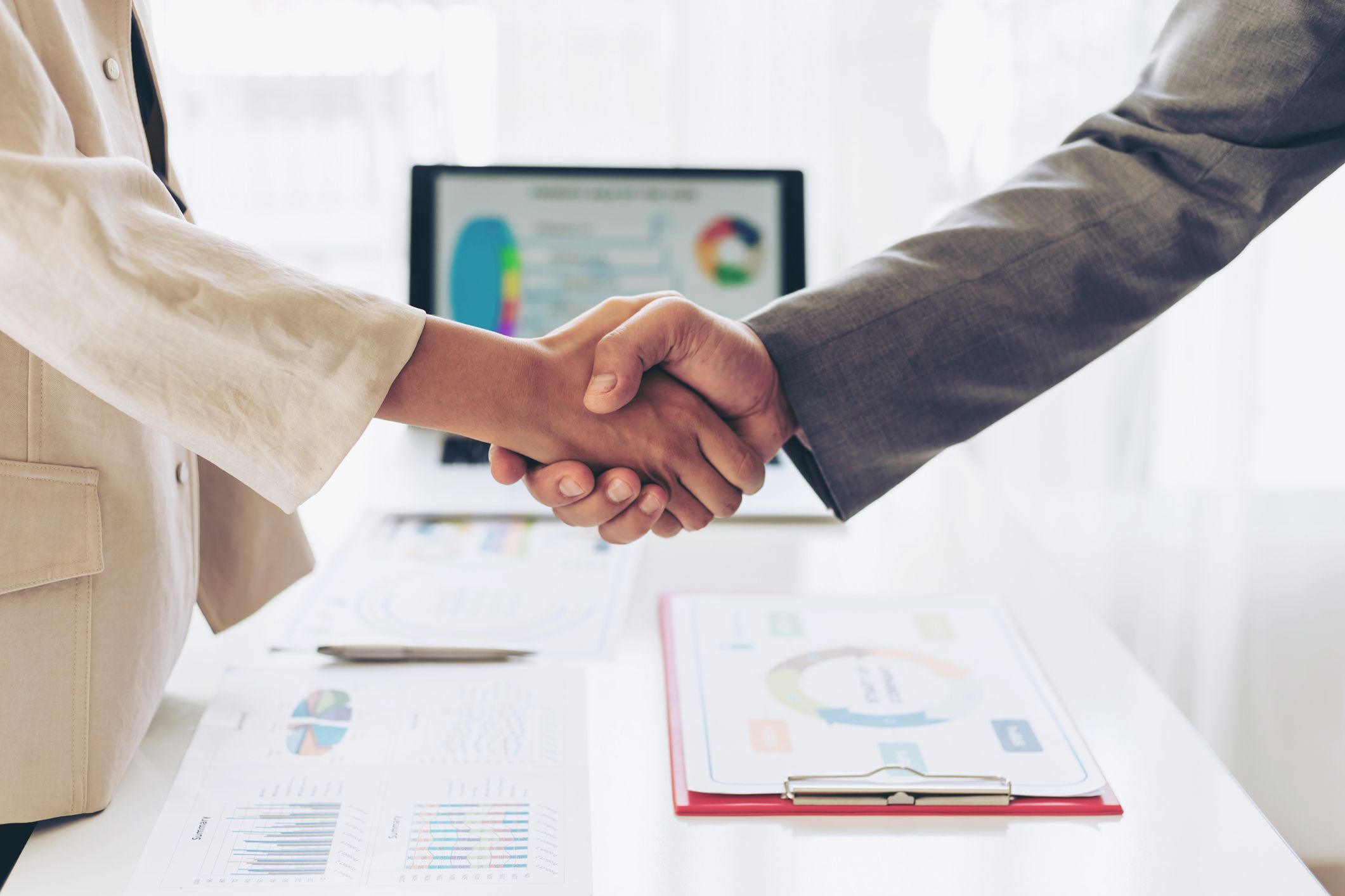 close up hand of business people shaking hands finishing up meeting showing unity , business teamwork concept